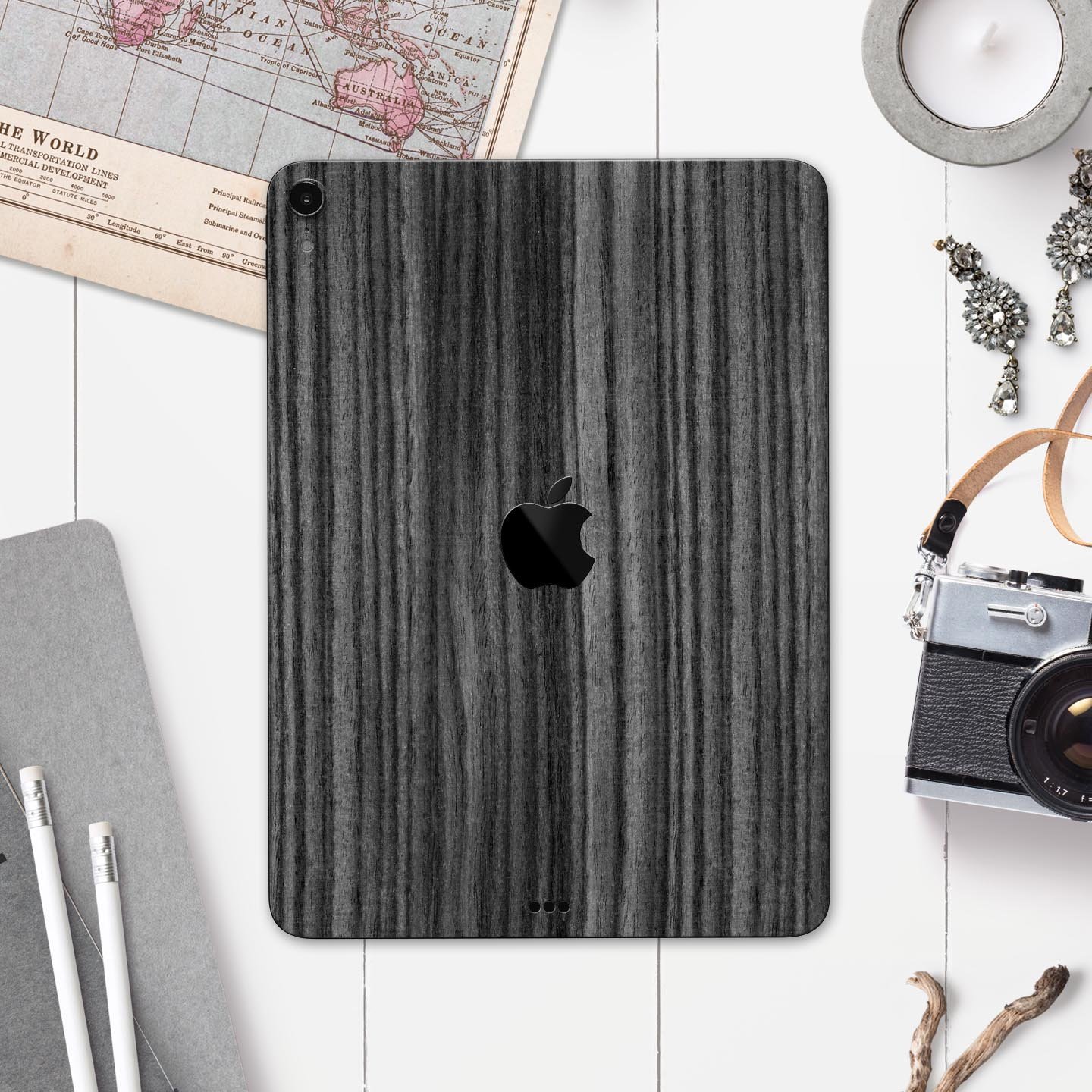 Dark Ebony Woodgrain skin decal for Apple iPad Pro, showcasing a sleek wood finish and precise cutouts for device features.