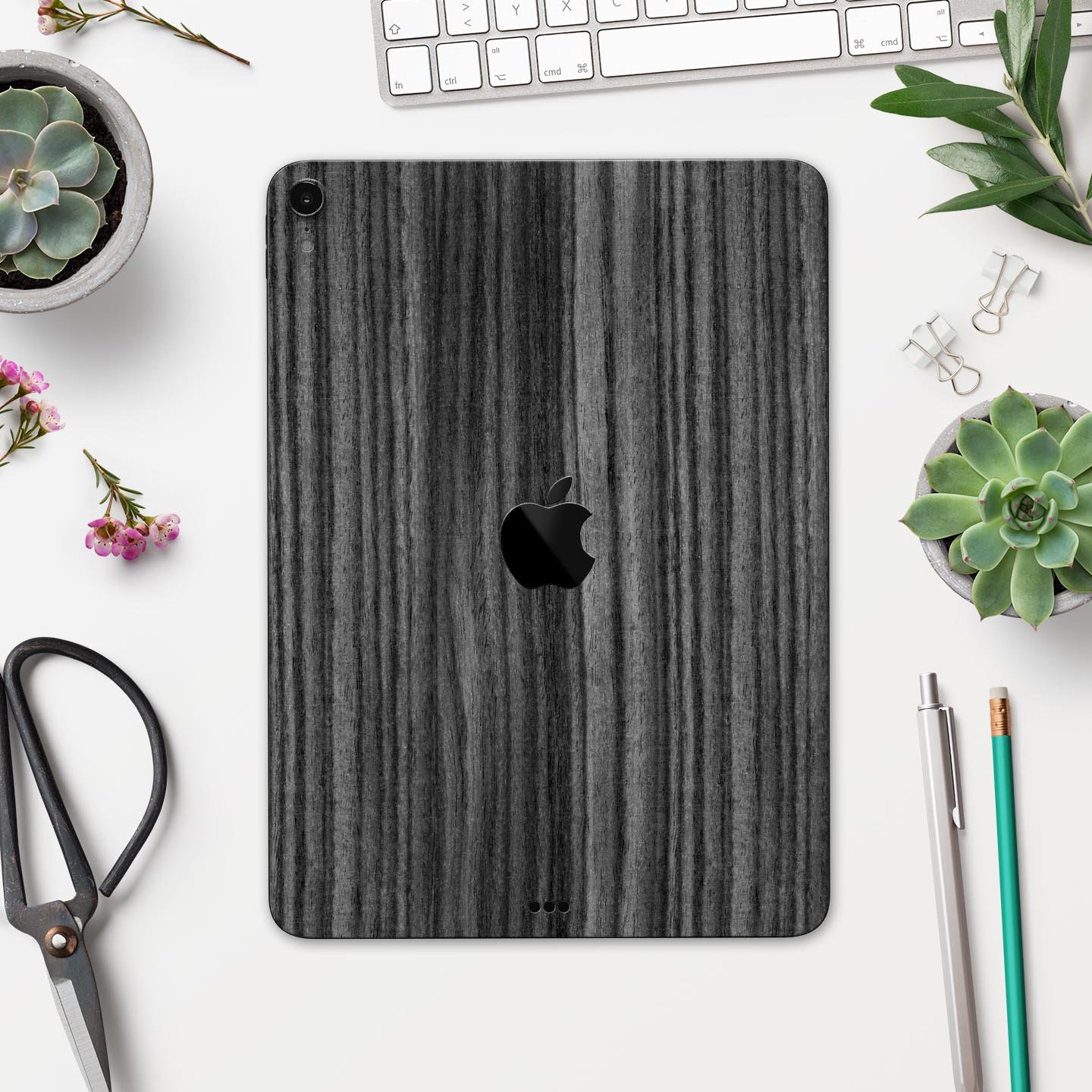 Dark Ebony Woodgrain skin decal for Apple iPad Pro, showcasing a sleek wood finish and precise cutouts for device features.