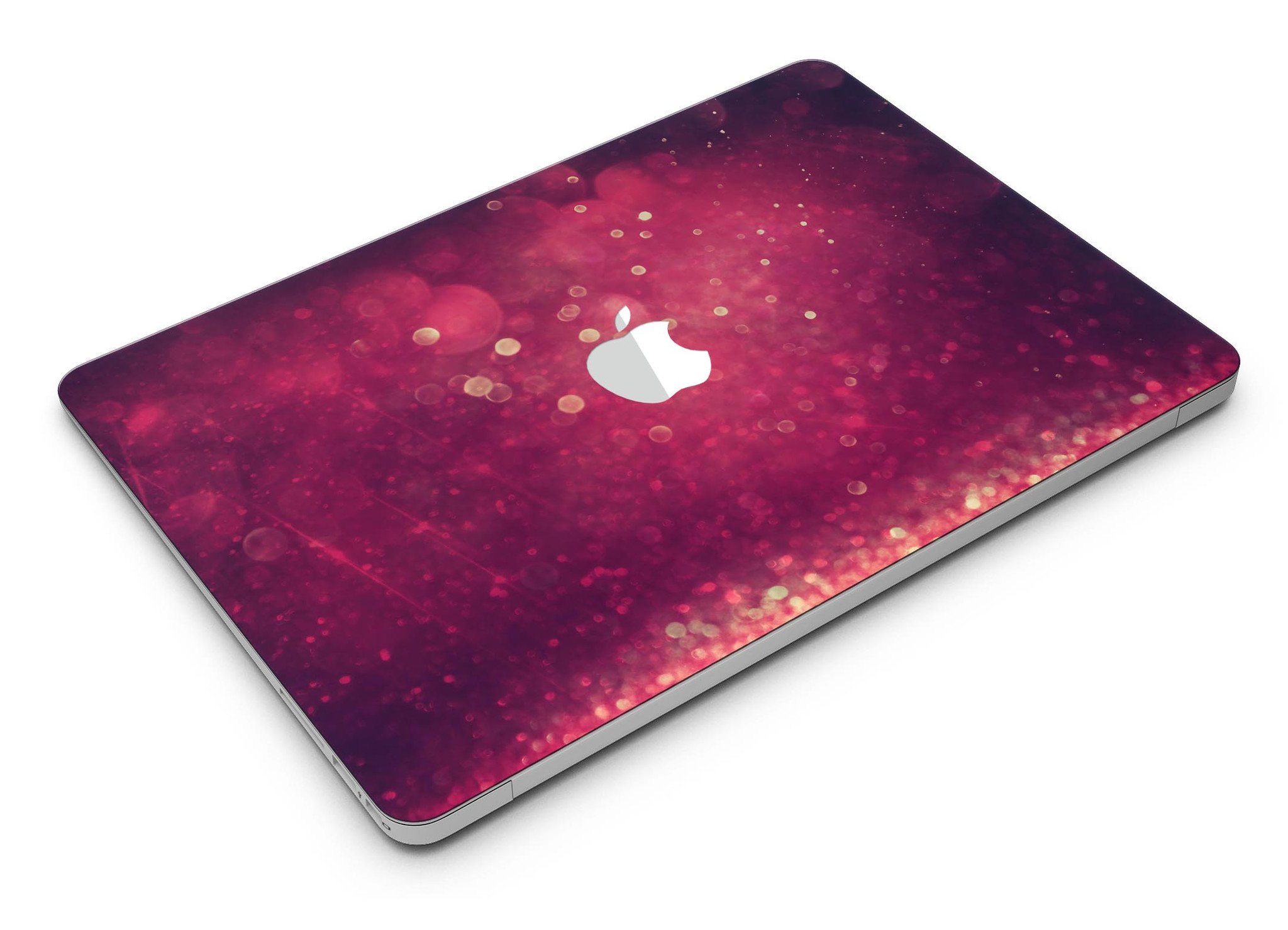 Dark pink shimmering orbs of light MacBook Air skin kit showcasing its vibrant design and premium vinyl material.