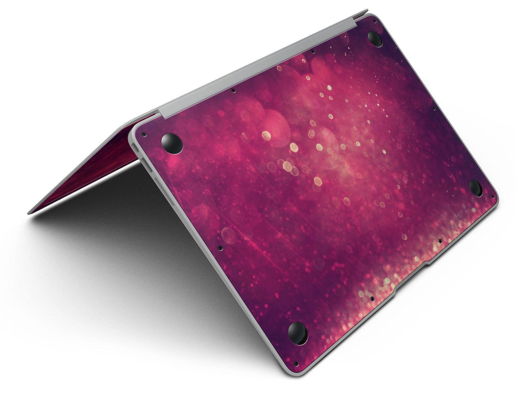 Dark pink shimmering orbs of light MacBook Air skin kit showcasing its vibrant design and premium vinyl material.