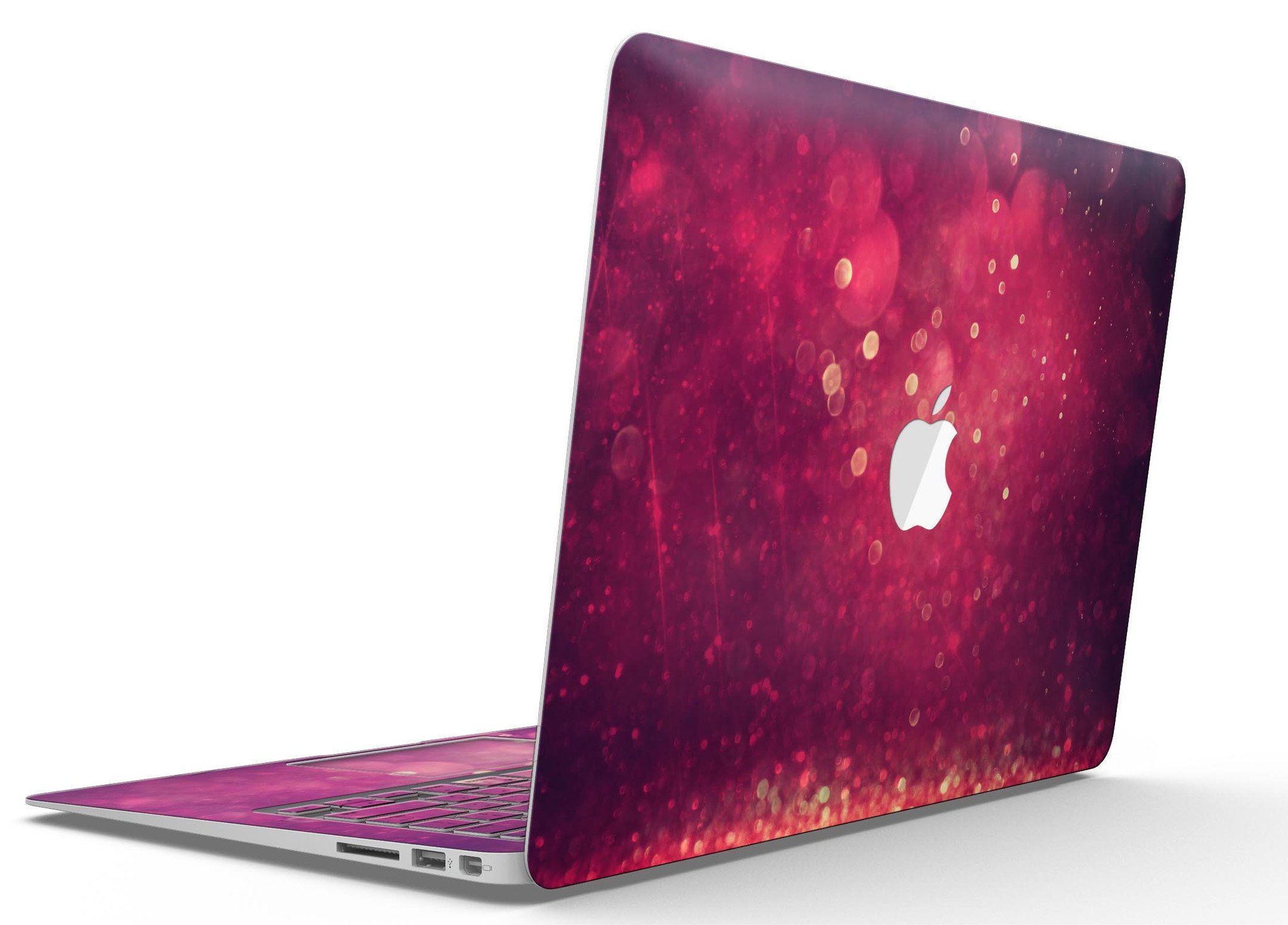 Dark pink shimmering orbs of light MacBook Air skin kit showcasing its vibrant design and premium vinyl material.