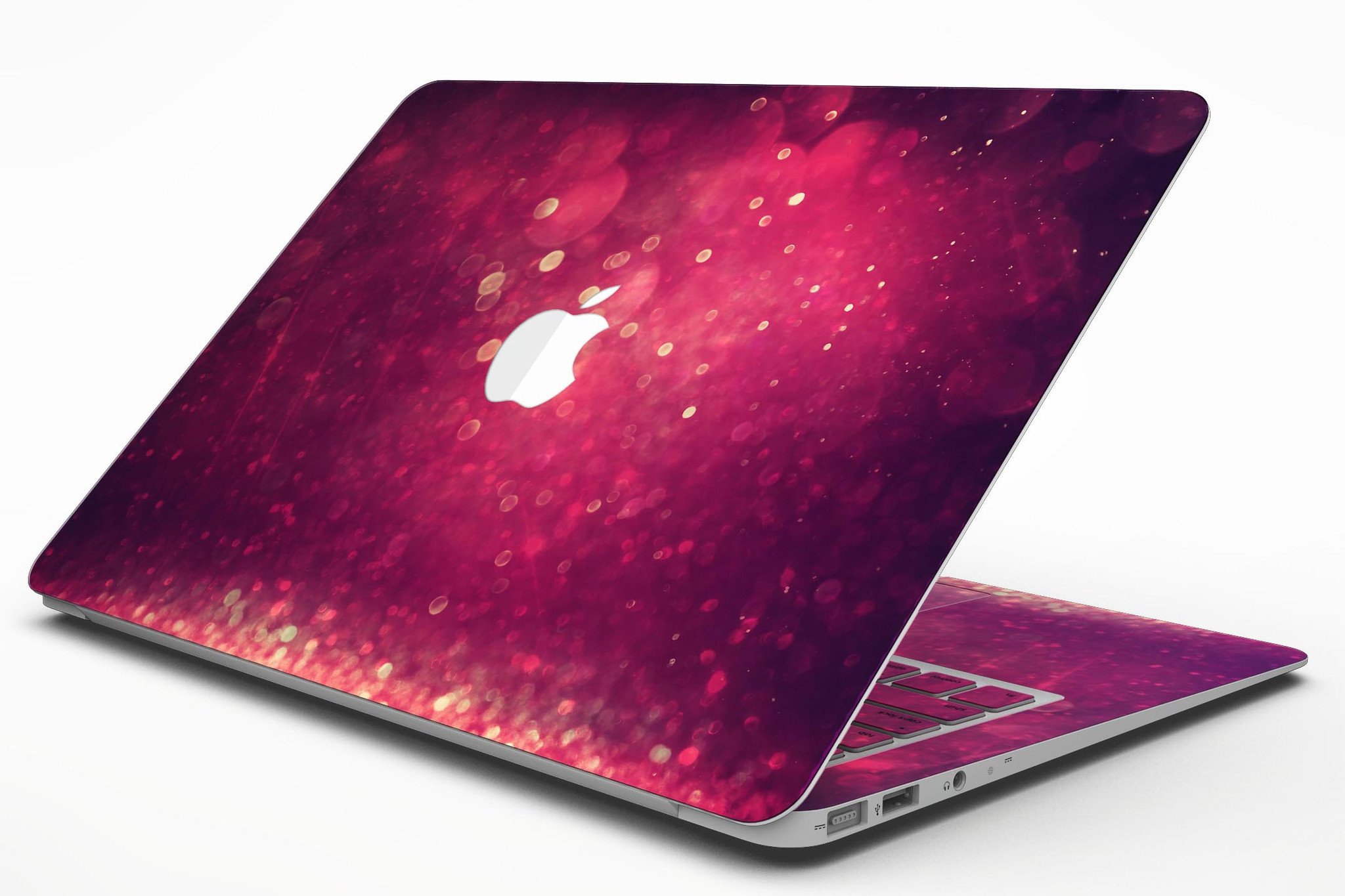 Dark pink shimmering orbs of light MacBook Air skin kit showcasing its vibrant design and premium vinyl material.