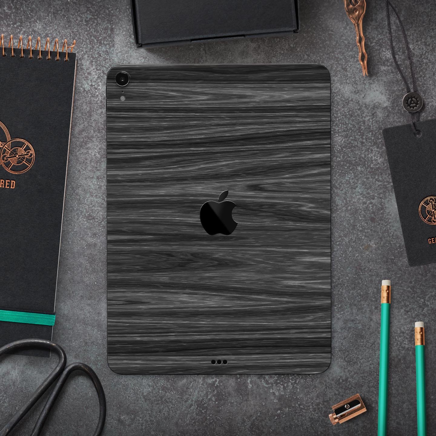 Dark Slate Wood skin decal for Apple iPad Pro 12.9", showcasing its premium finish and design.