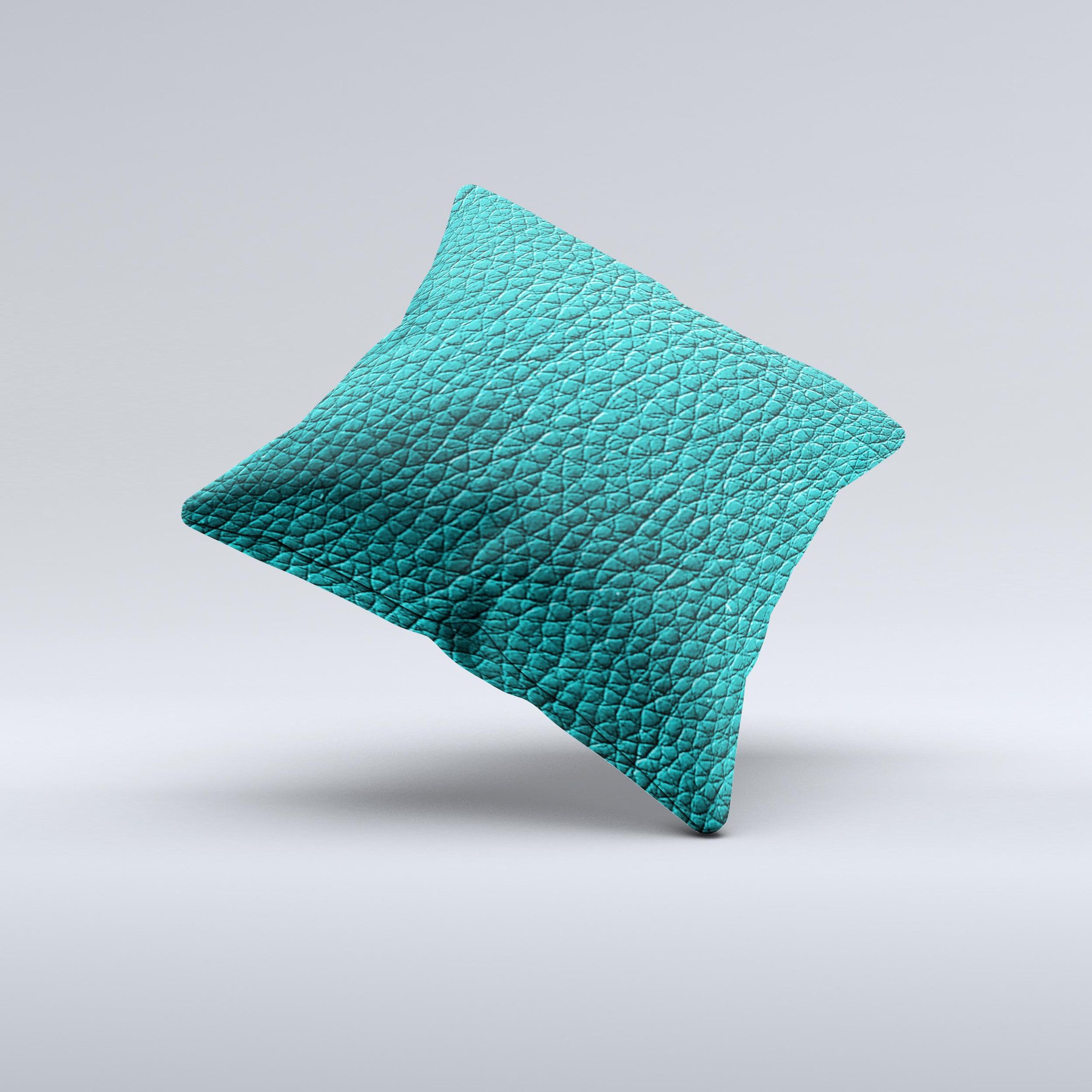 Dark teal leather decorative throw pillow with ink-fuzed design, handcrafted in Virginia, showcasing unique imperfections.