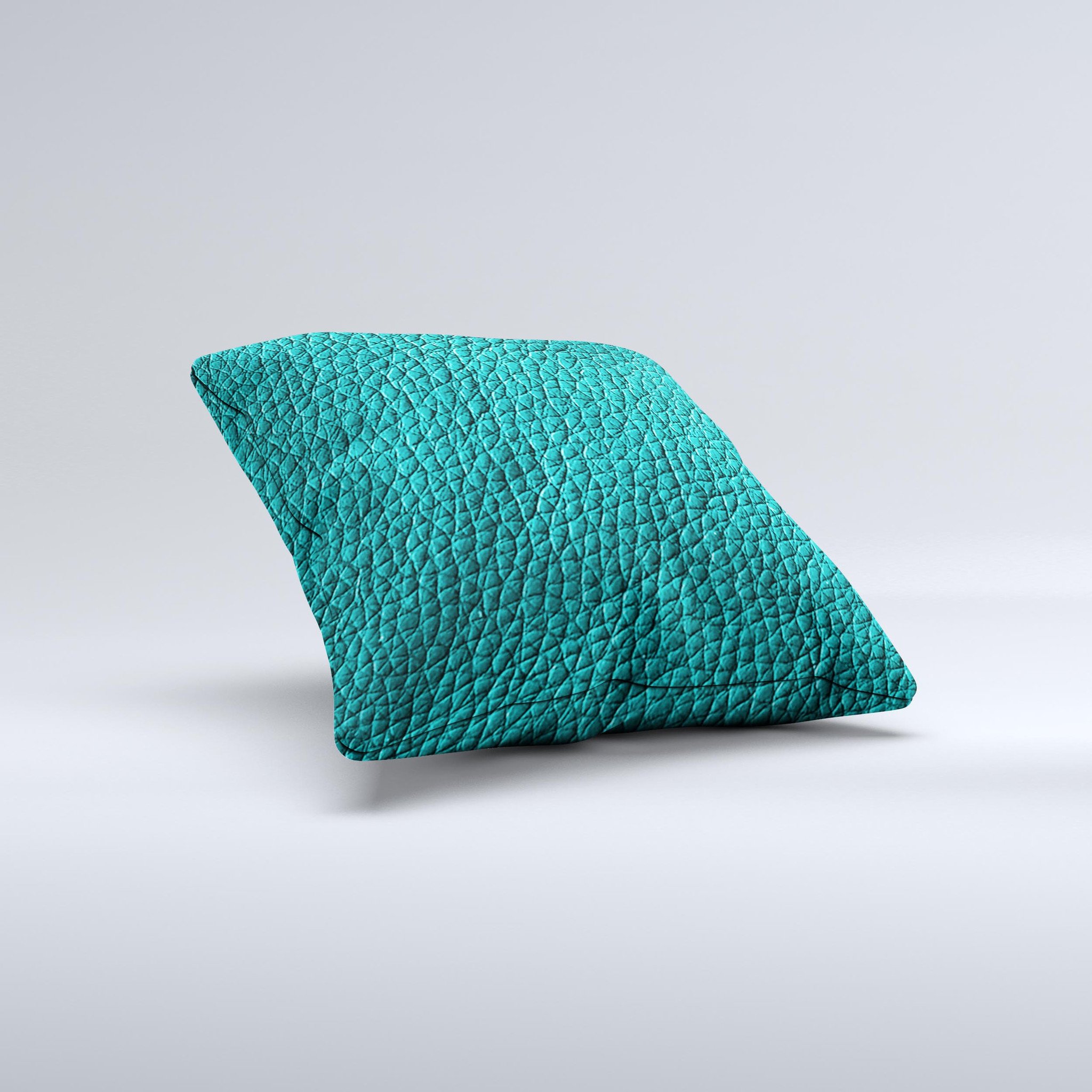 Dark teal leather decorative throw pillow with ink-fuzed design, handcrafted in Virginia, showcasing unique imperfections.