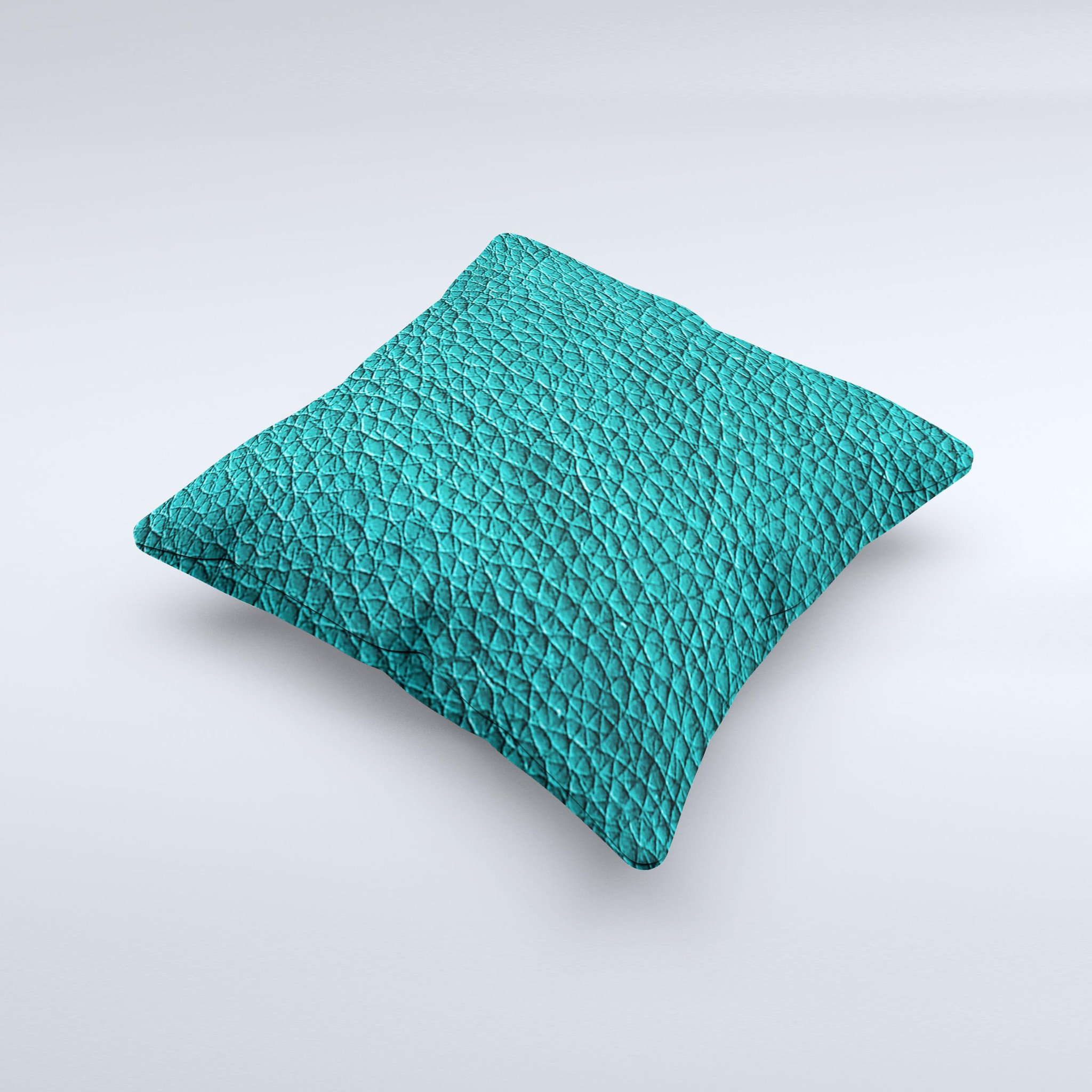 Dark teal leather decorative throw pillow with ink-fuzed design, handcrafted in Virginia, showcasing unique imperfections.