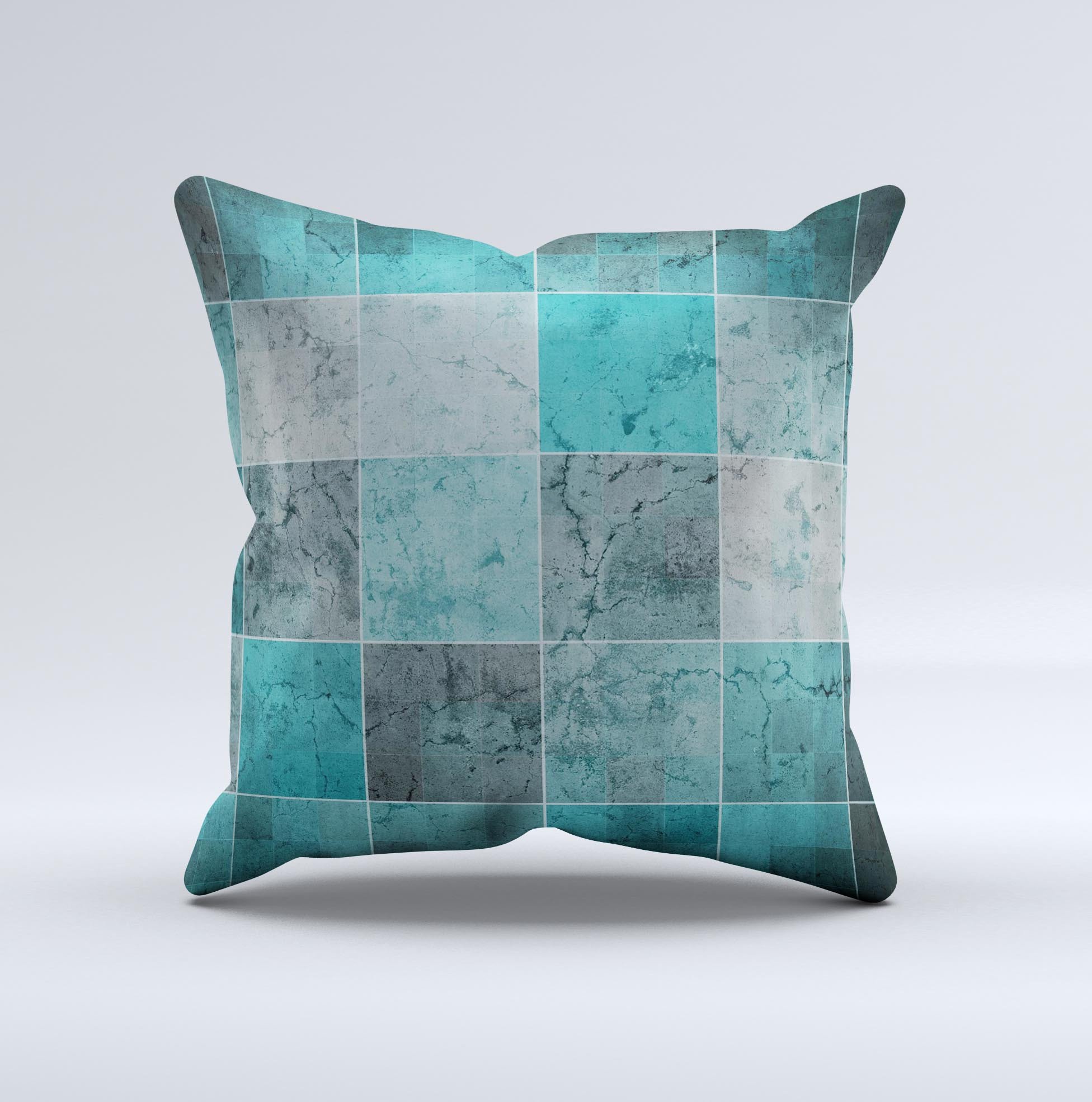 Dark teal decorative throw pillow with tiled pattern, handcrafted in Virginia, showcasing unique imperfections.