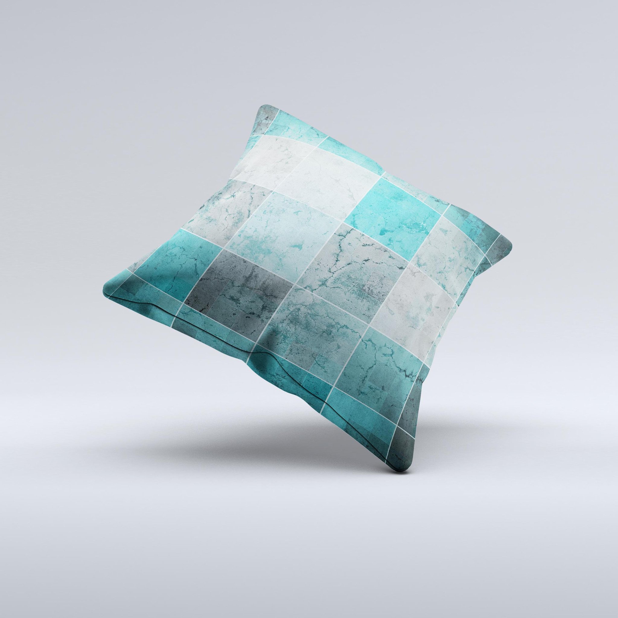 Dark teal decorative throw pillow with tiled pattern, handcrafted in Virginia, showcasing unique imperfections.