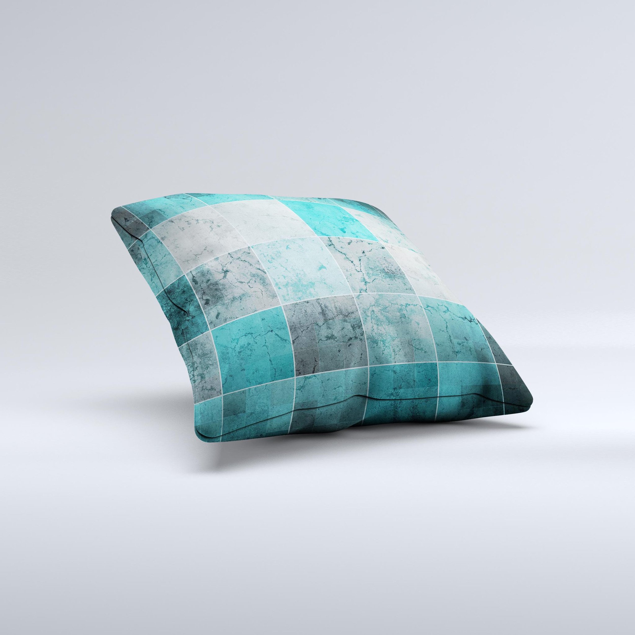 Dark teal decorative throw pillow with tiled pattern, handcrafted in Virginia, showcasing unique imperfections.