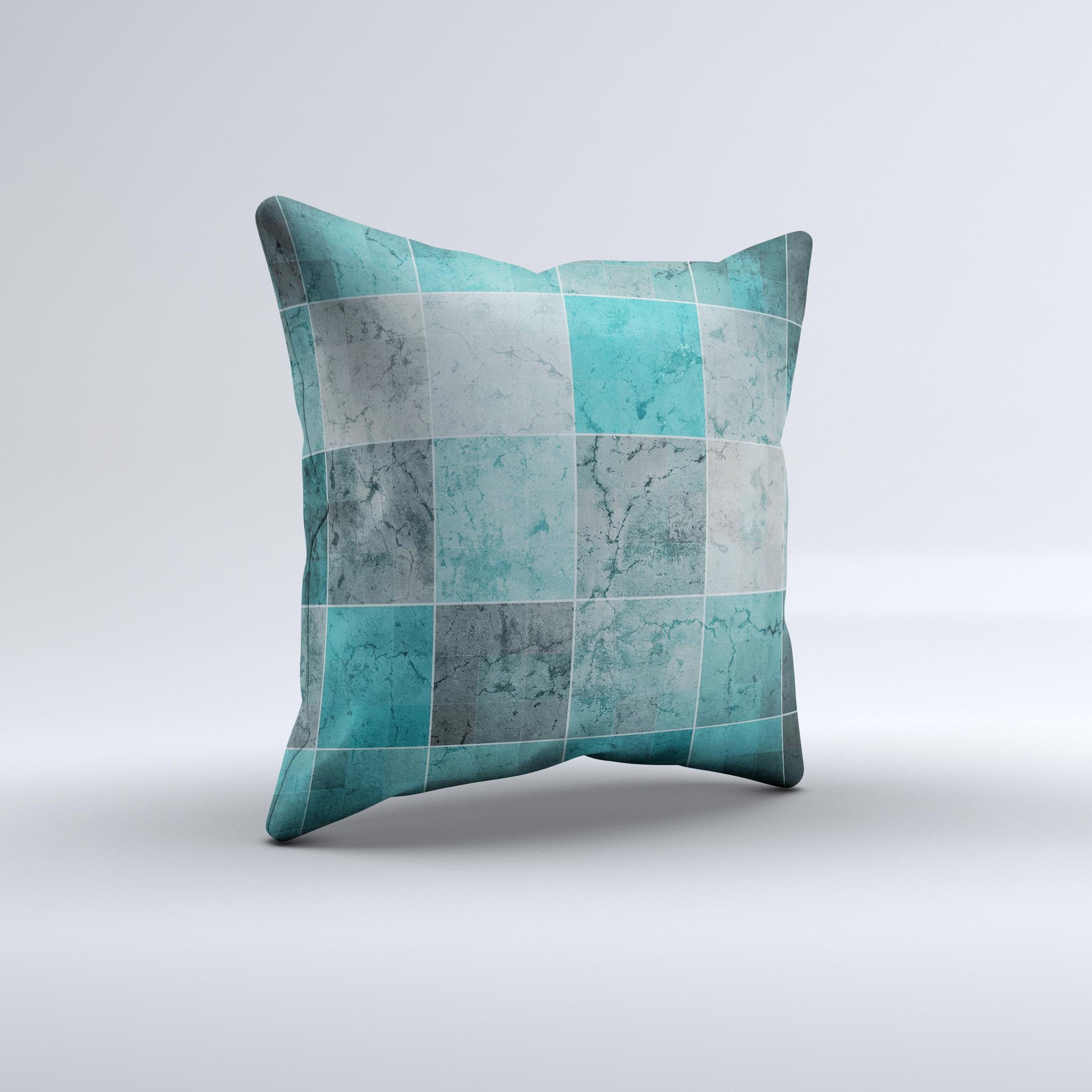 Dark teal decorative throw pillow with tiled pattern, handcrafted in Virginia, showcasing unique imperfections.