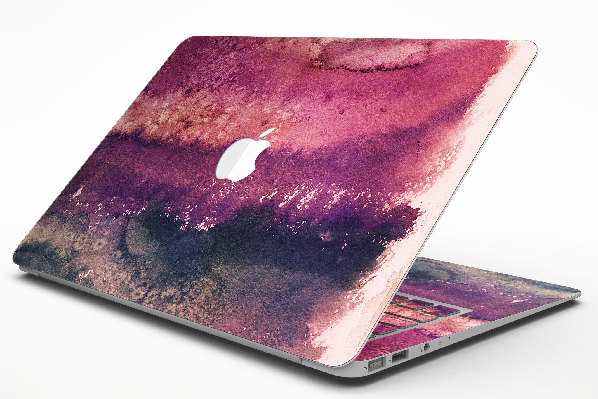 Dark v2bsorbed Watercolor Texture skin applied to a MacBook Air, showcasing vibrant colors and sleek design.