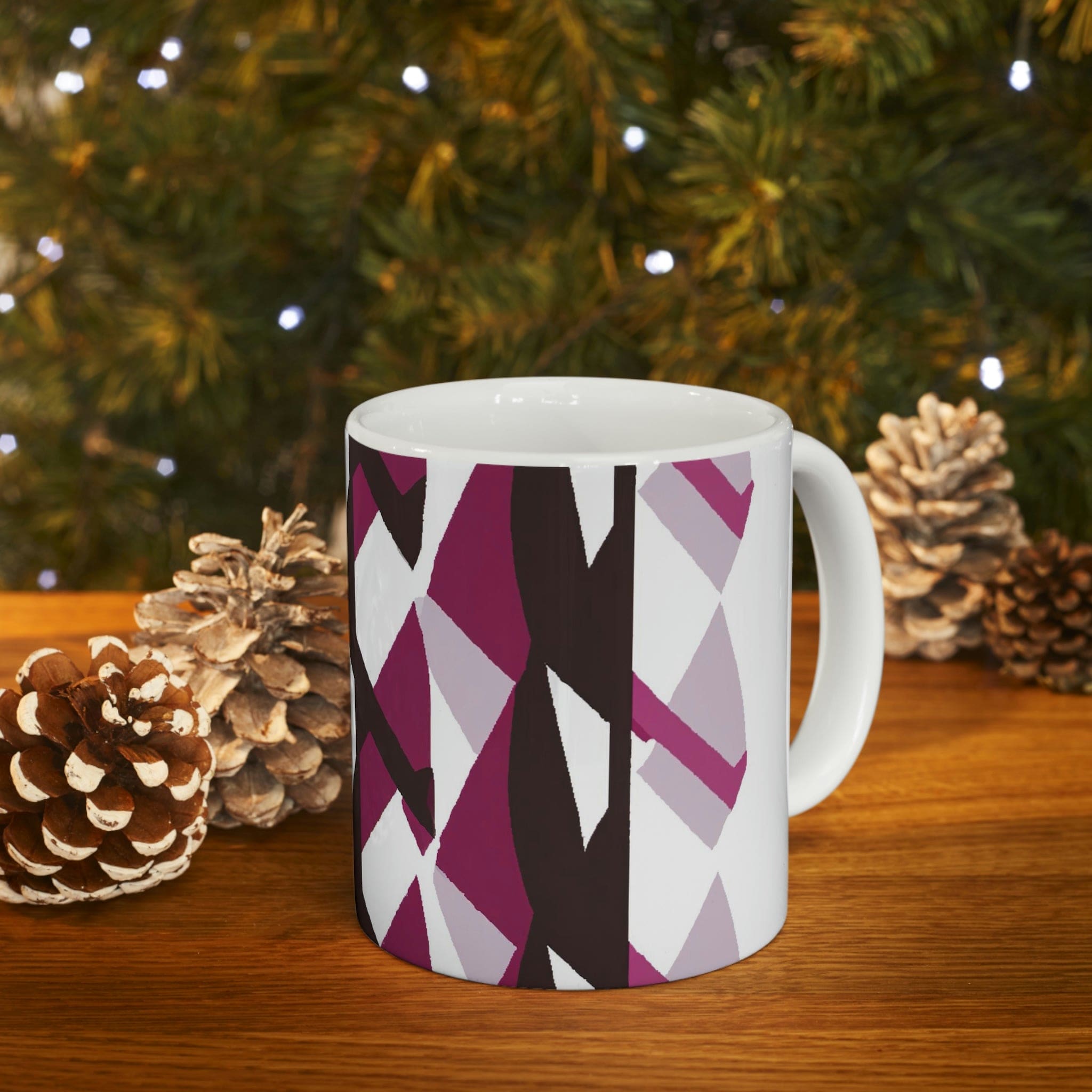 Decorative ceramic coffee mug in mauve pink and maroon geometric pattern, showcasing its elegant design and durable ceramic material.