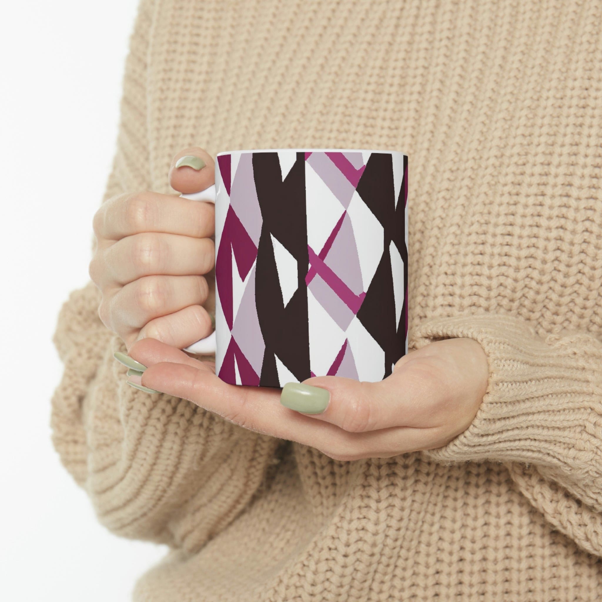 Decorative ceramic coffee mug in mauve pink and maroon geometric pattern, showcasing its elegant design and durable ceramic material.