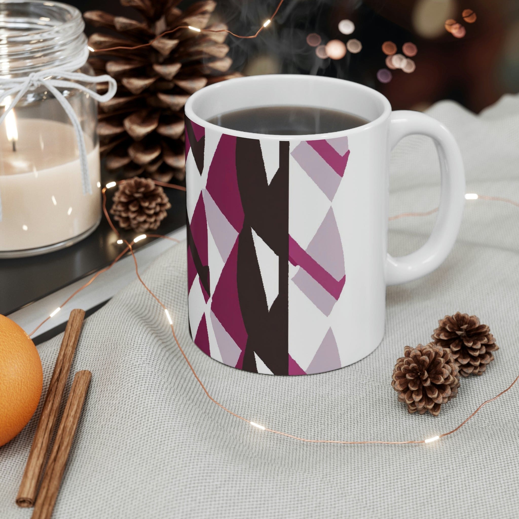 Decorative ceramic coffee mug in mauve pink and maroon geometric pattern, showcasing its elegant design and durable ceramic material.