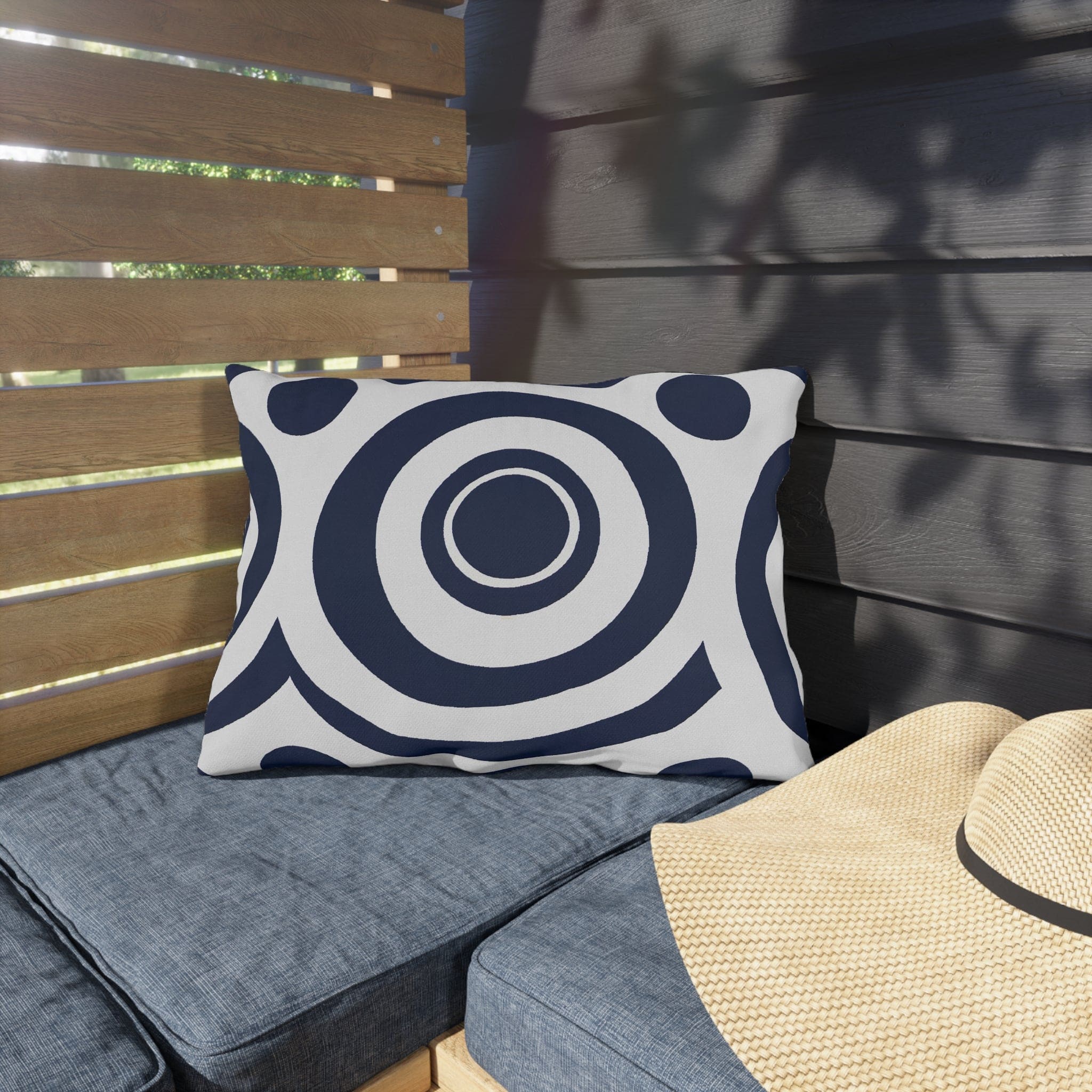 Navy blue and white circular decorative throw pillow designed for indoor and outdoor use, showcasing vibrant patterns and quality craftsmanship.