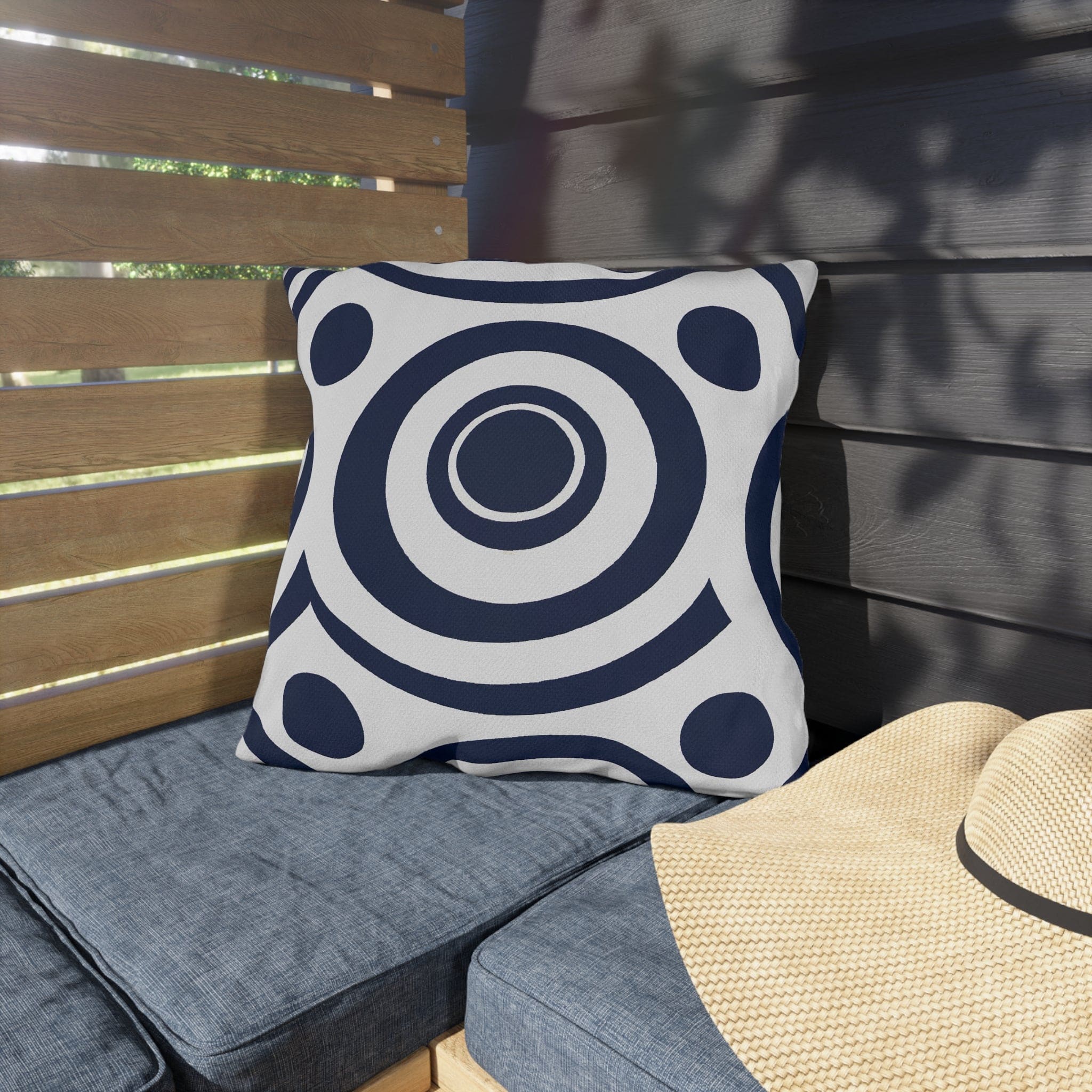 Navy blue and white circular decorative throw pillow designed for indoor and outdoor use, showcasing vibrant patterns and quality craftsmanship.