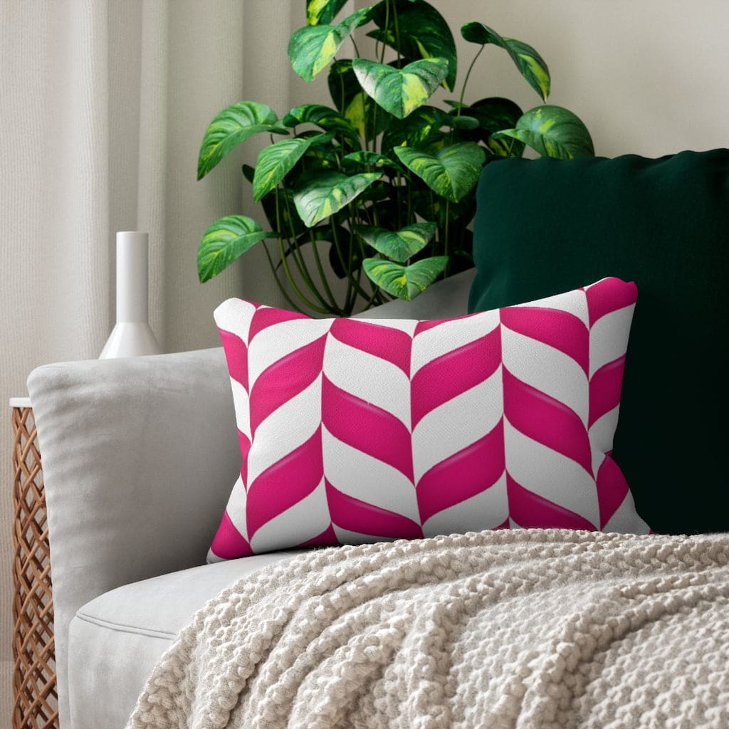 Decorative lumbar throw pillow featuring a pink chevron pattern, made of spun-polyester fabric with a concealed zipper.