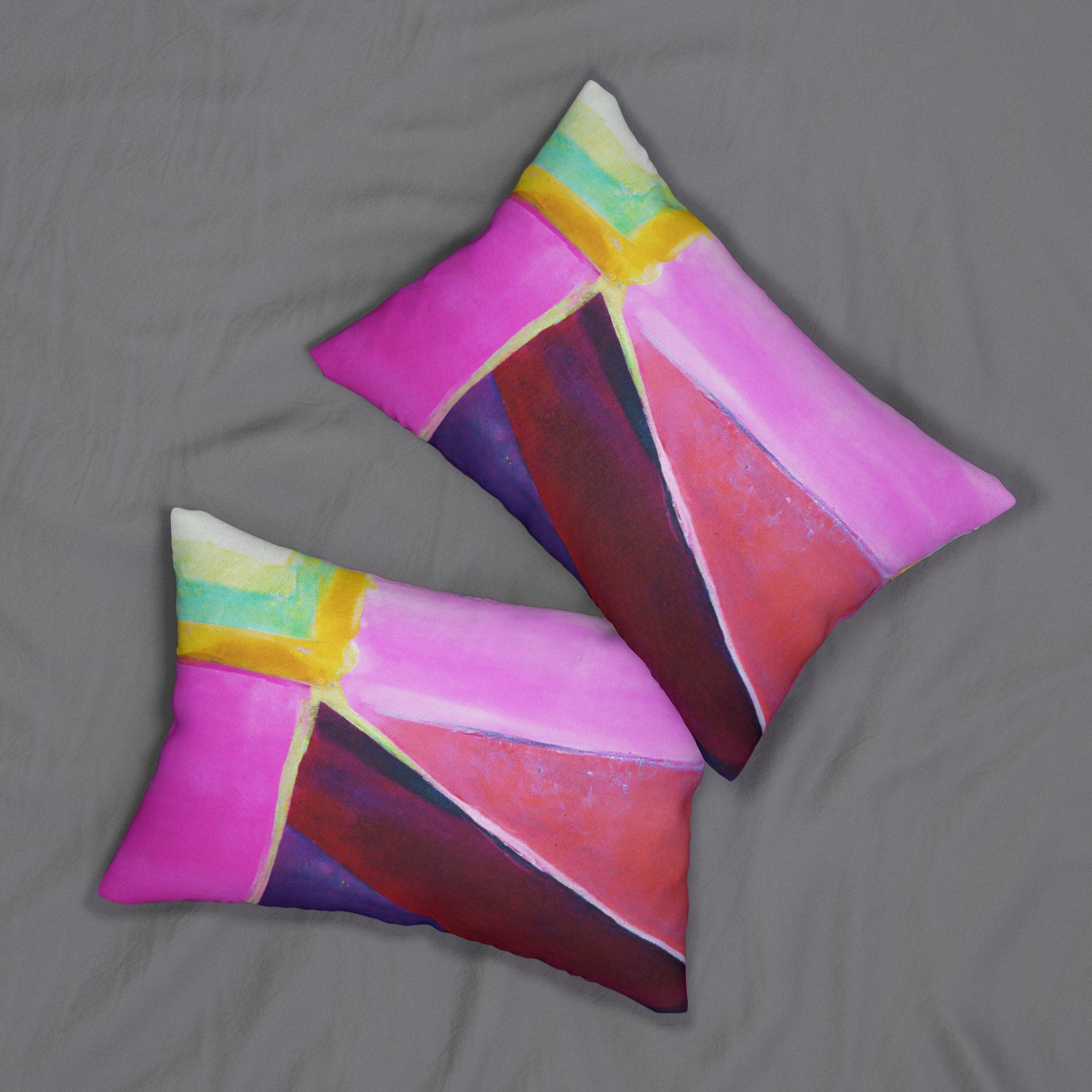 Decorative lumbar throw pillow featuring a vibrant pink, purple, and red geometric pattern, perfect for enhancing home decor.