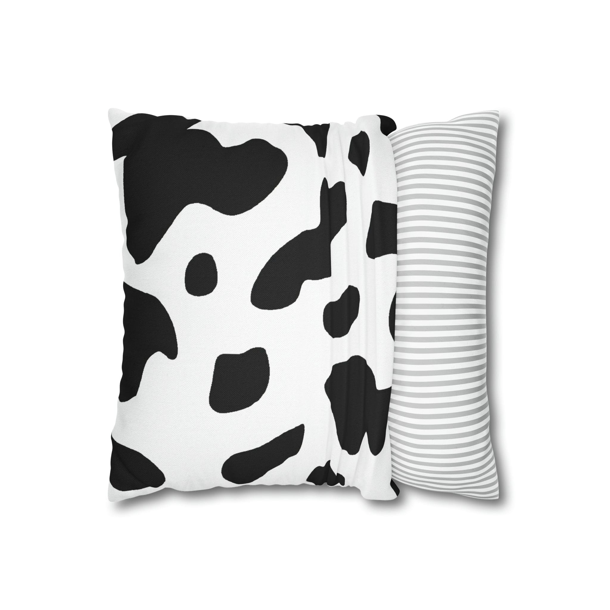 Decorative throw pillow cover featuring a black and white abstract cow print design, showcasing its stylish and modern aesthetic.