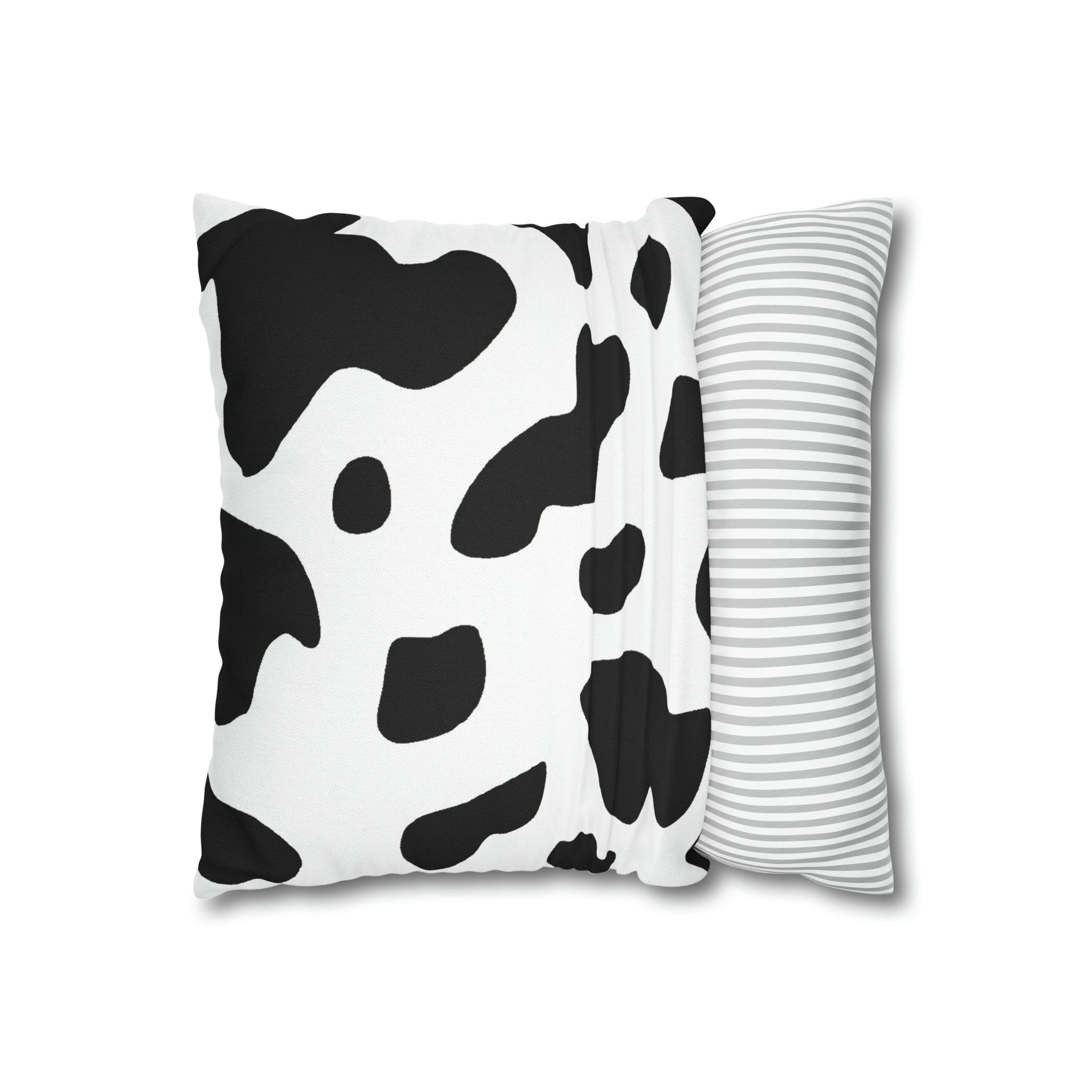 Decorative throw pillow cover featuring a black and white abstract cow print design, showcasing its stylish and modern aesthetic.