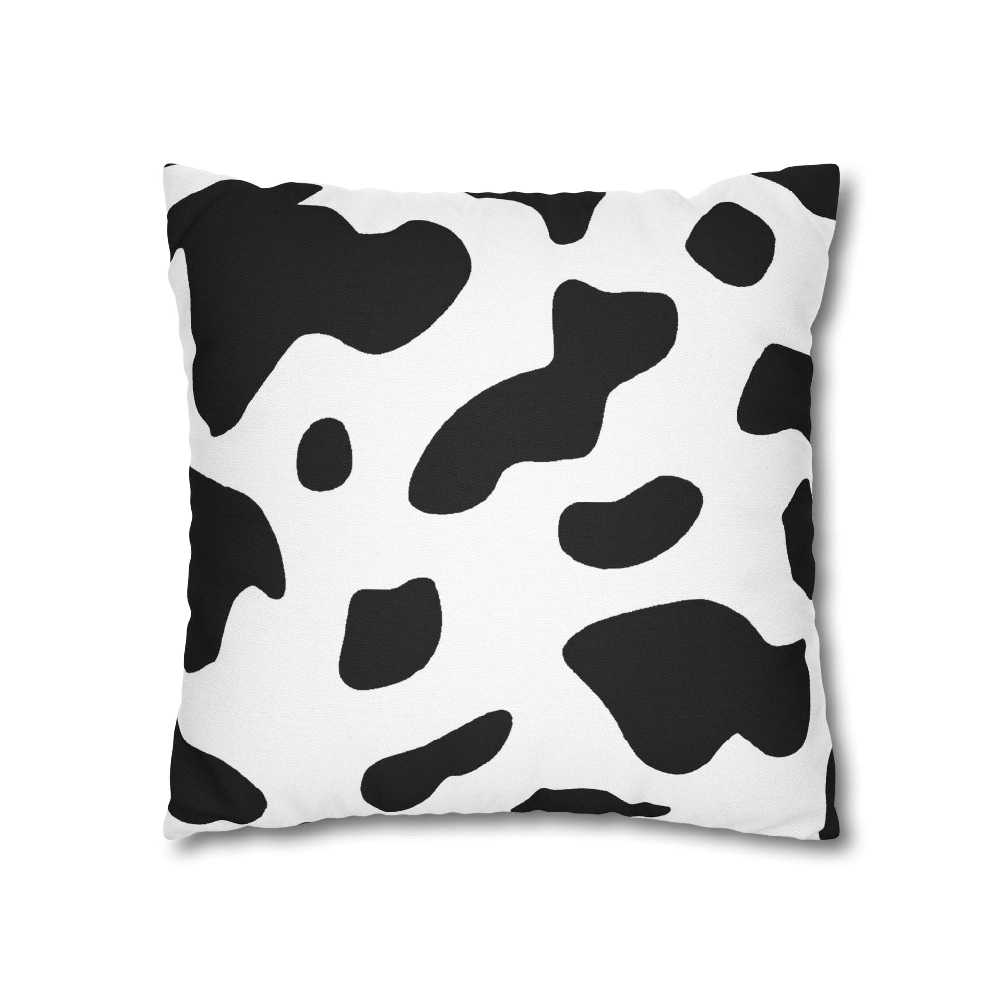 Decorative throw pillow cover featuring a black and white abstract cow print design, showcasing its stylish and modern aesthetic.