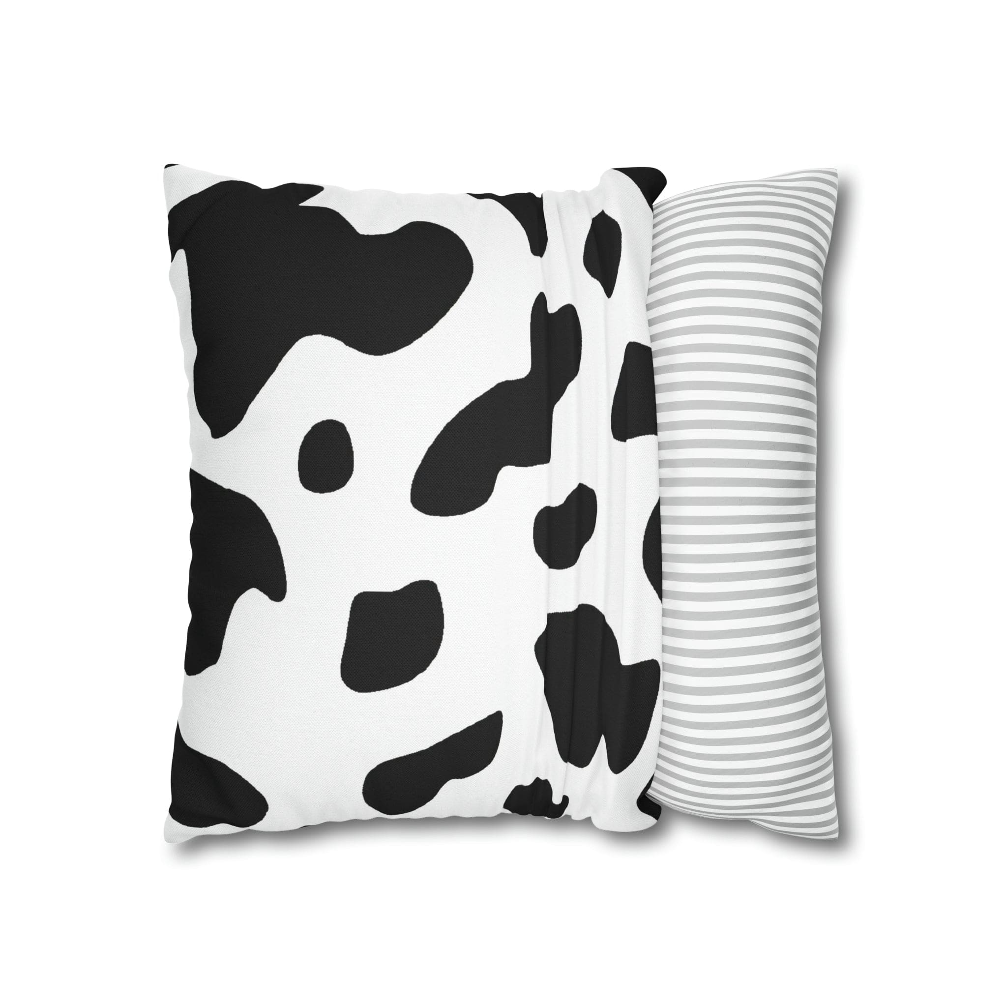 Decorative throw pillow cover featuring a black and white abstract cow print design, showcasing its stylish and modern aesthetic.