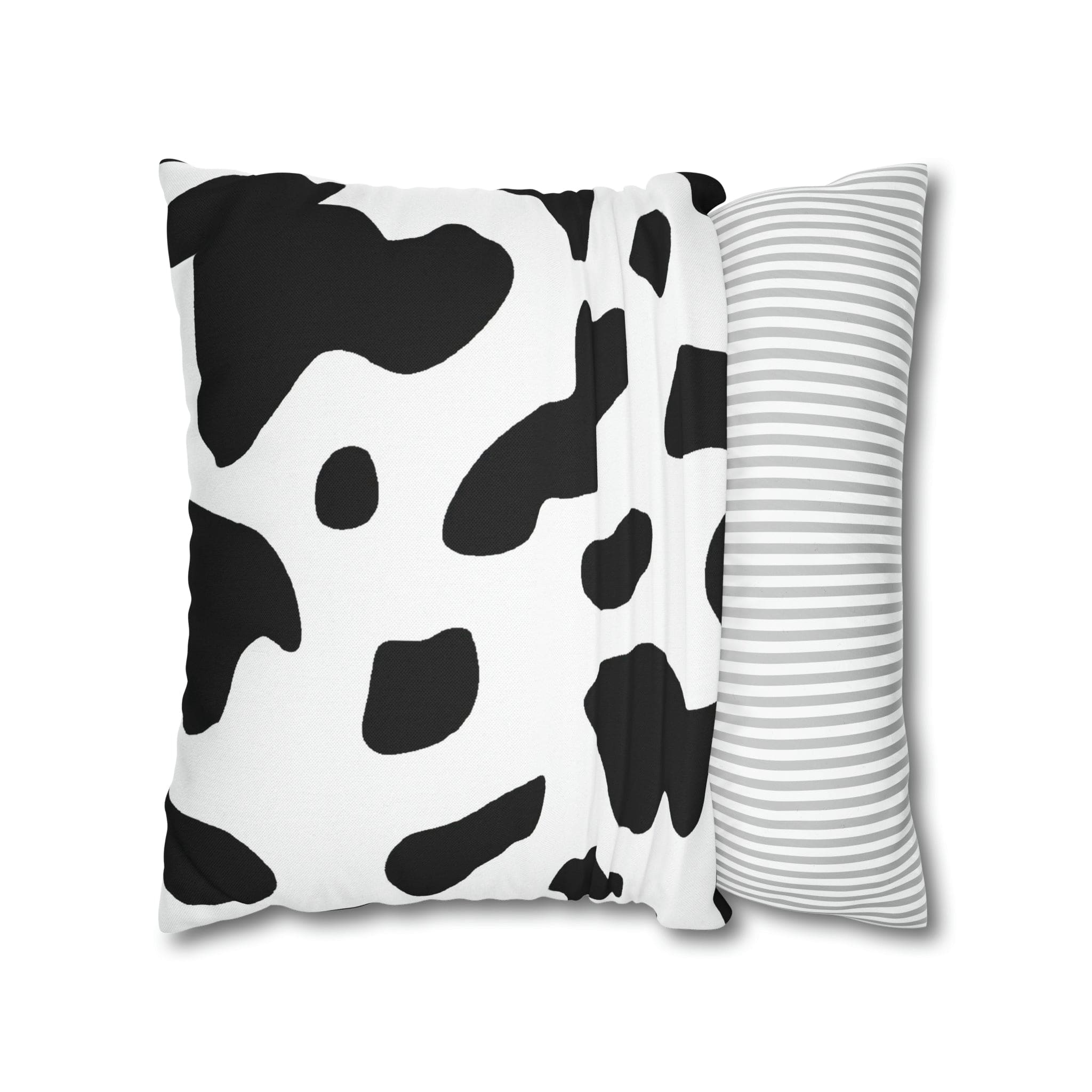 Decorative throw pillow cover featuring a black and white abstract cow print design, showcasing its stylish and modern aesthetic.