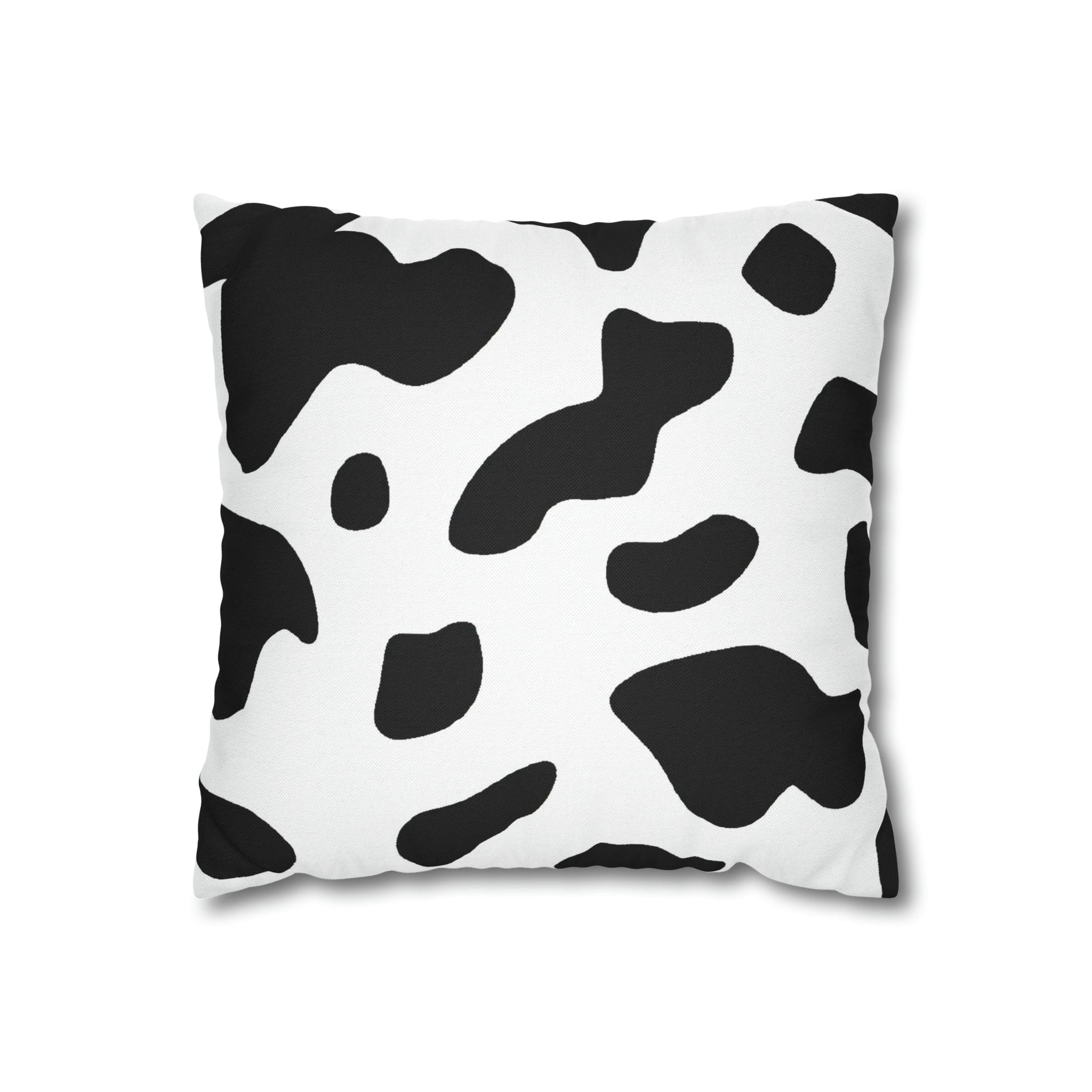 Decorative throw pillow cover featuring a black and white abstract cow print design, showcasing its stylish and modern aesthetic.