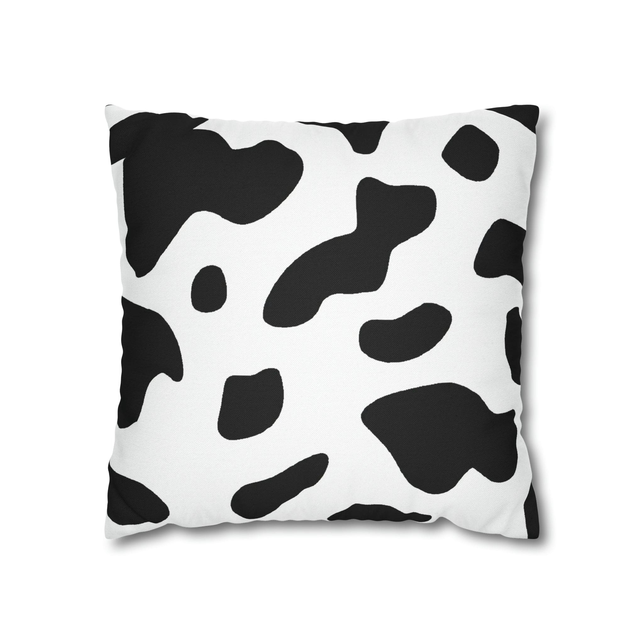 Decorative throw pillow cover featuring a black and white abstract cow print design, showcasing its stylish and modern aesthetic.