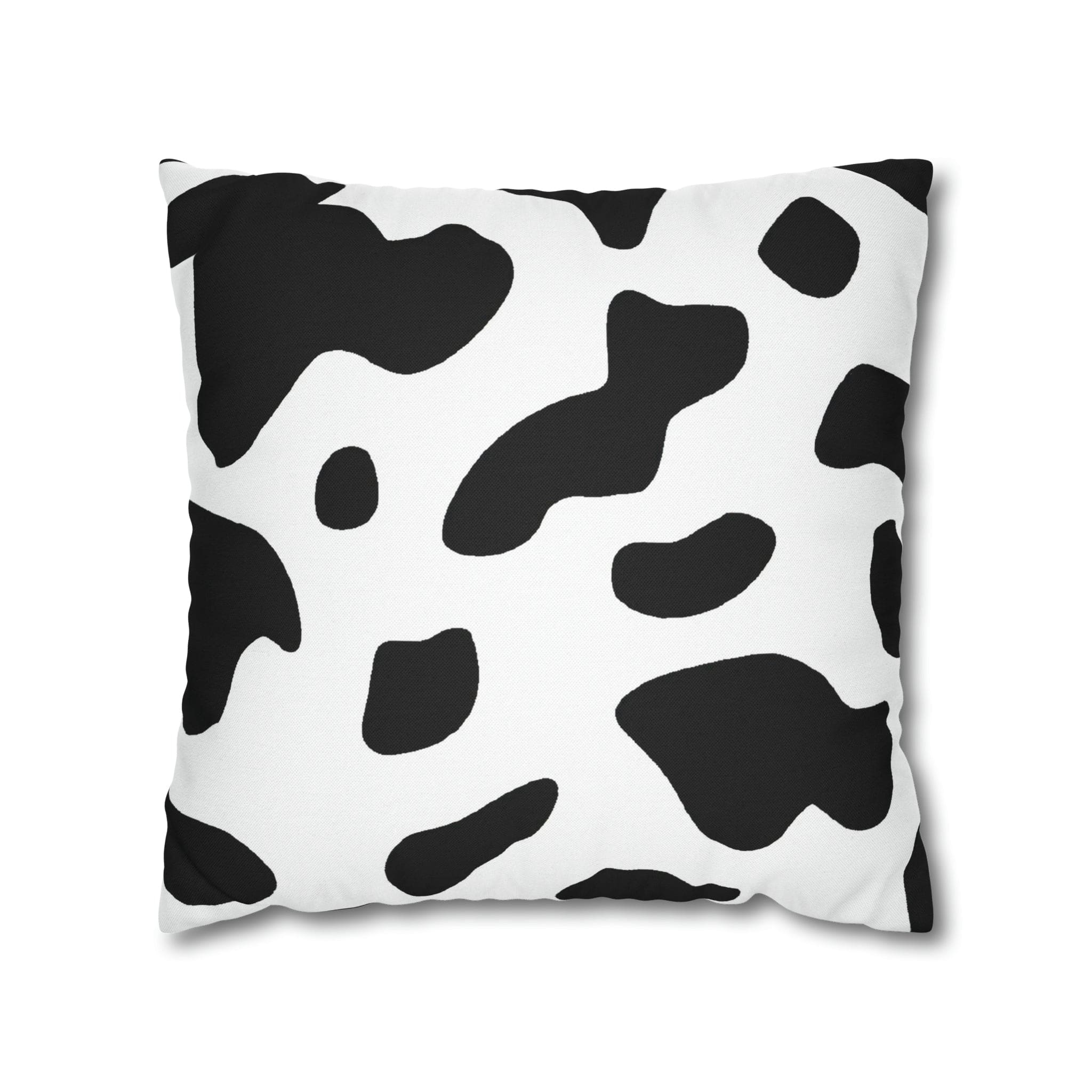 Decorative throw pillow cover featuring a black and white abstract cow print design, showcasing its stylish and modern aesthetic.