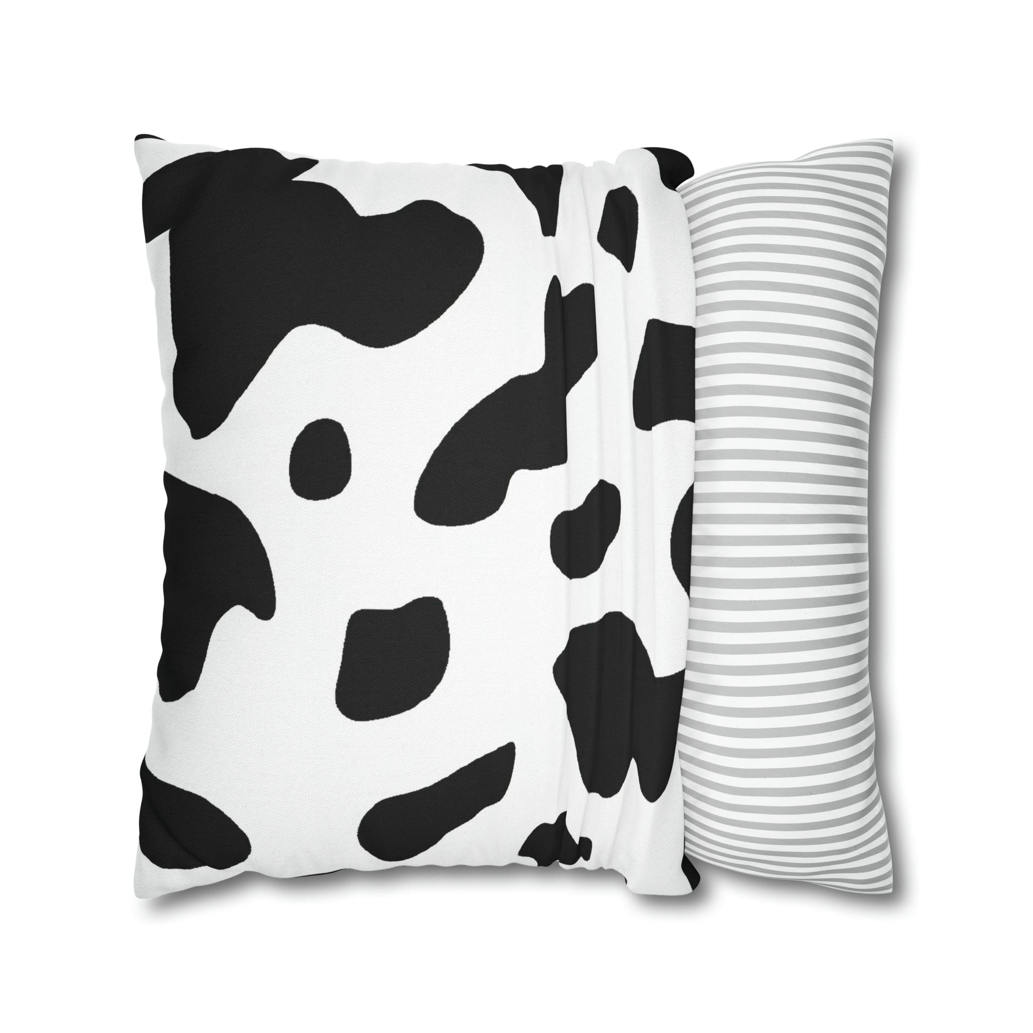 Decorative throw pillow cover featuring a black and white abstract cow print design, showcasing its stylish and modern aesthetic.