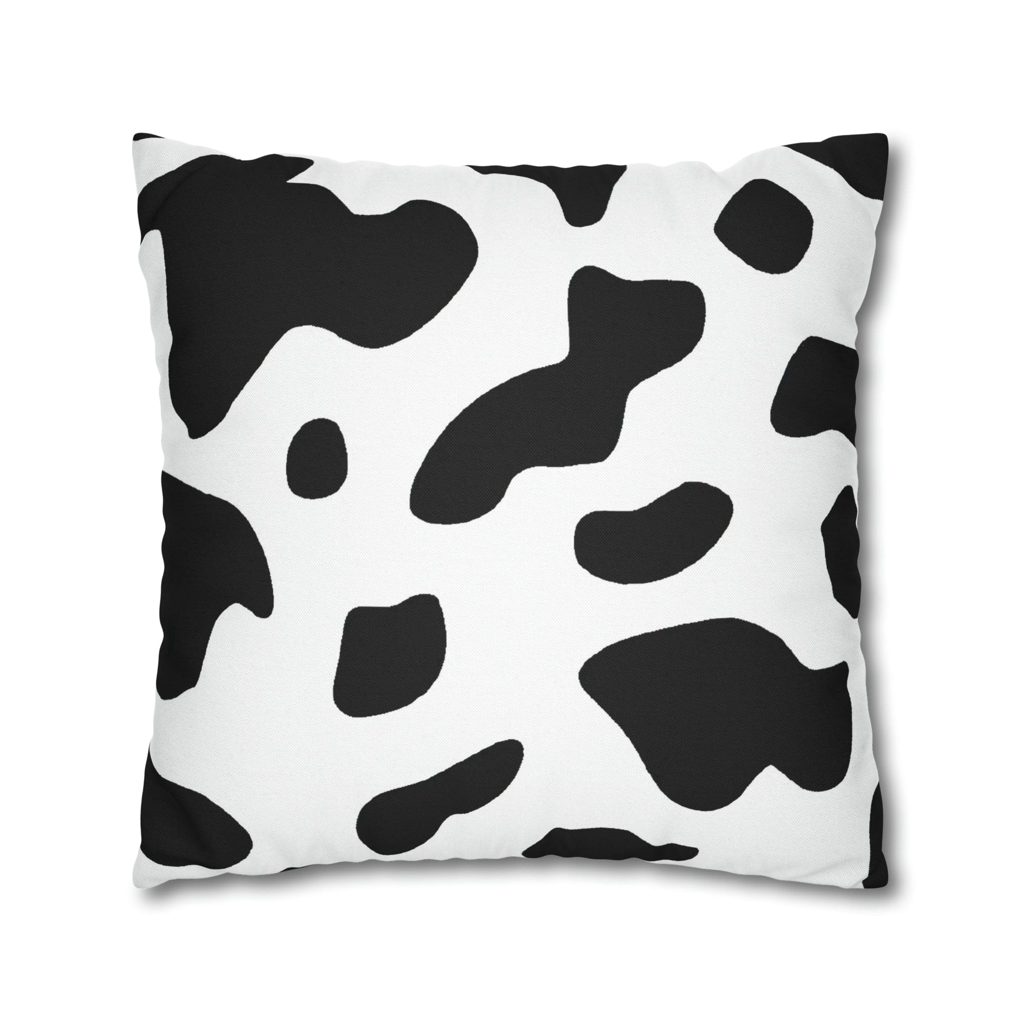 Decorative throw pillow cover featuring a black and white abstract cow print design, showcasing its stylish and modern aesthetic.