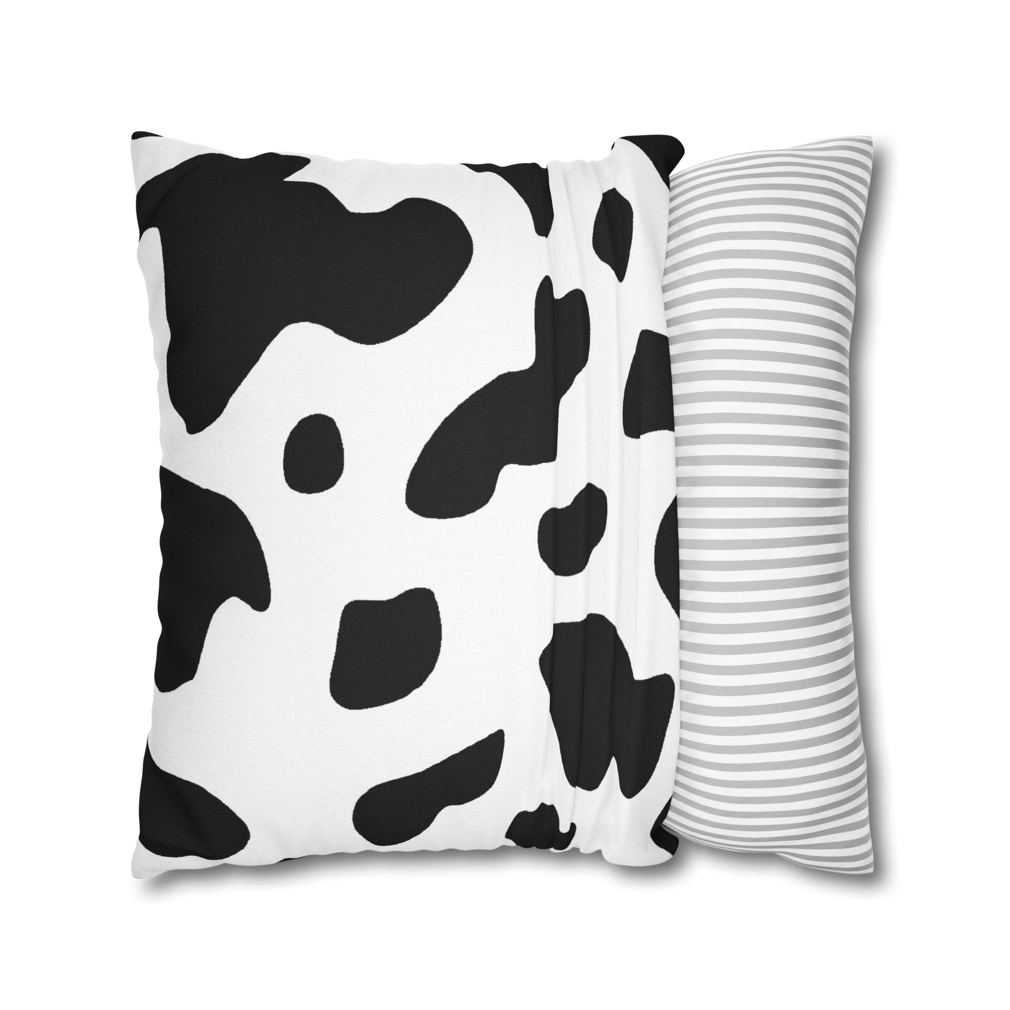 Decorative throw pillow cover featuring a black and white abstract cow print design, showcasing its stylish and modern aesthetic.