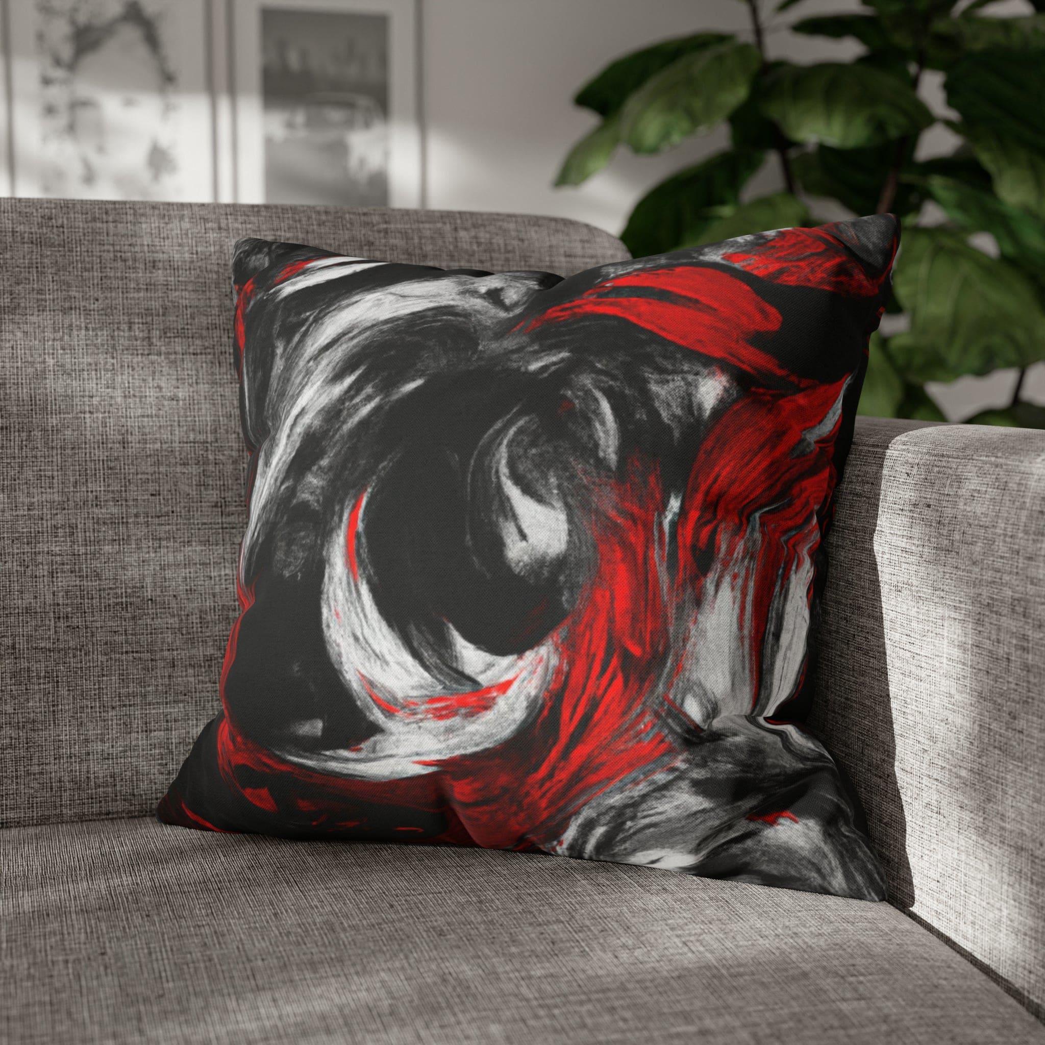 Decorative throw pillow cover featuring a black, red, and white abstract pattern, ideal for enhancing home decor.