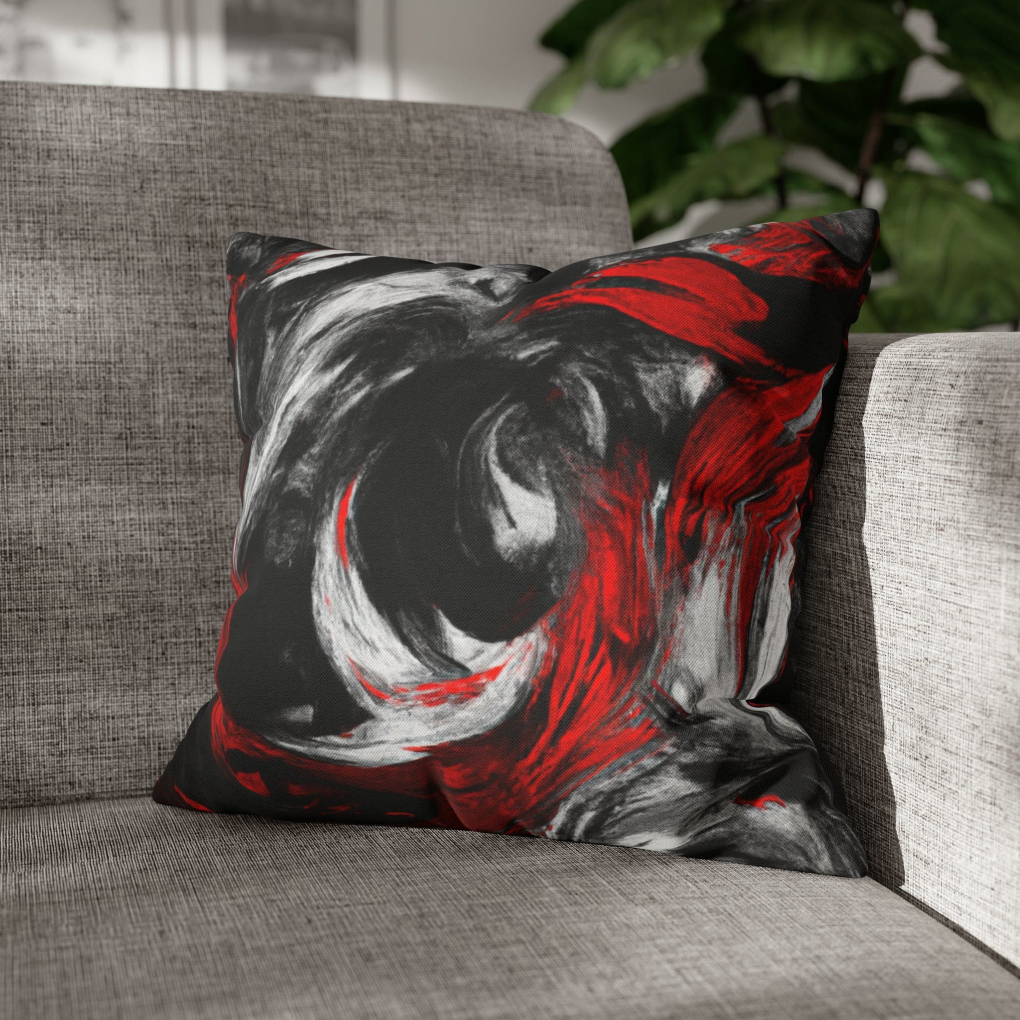 Decorative throw pillow cover featuring a black, red, and white abstract pattern, ideal for enhancing home decor.