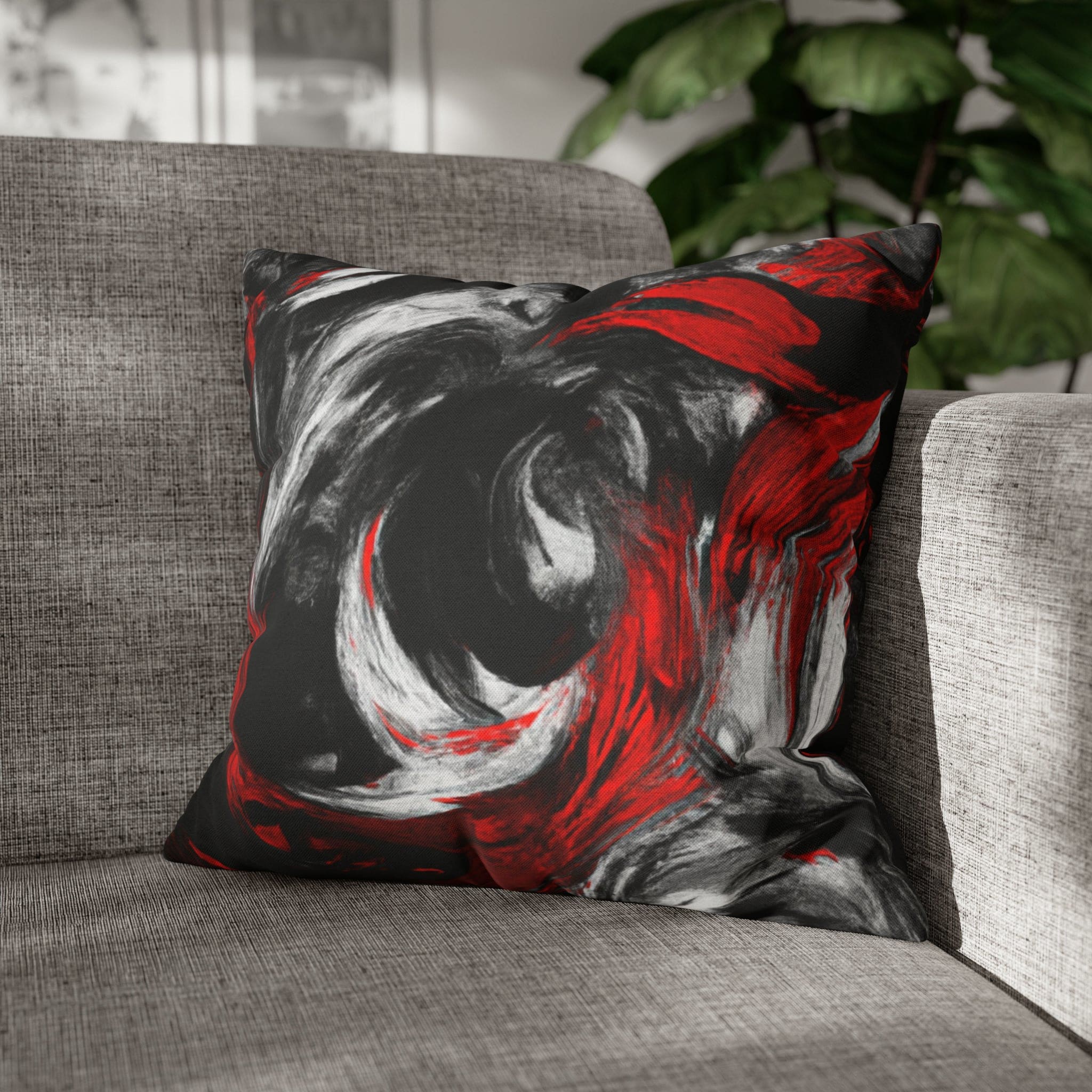 Decorative throw pillow cover featuring a black, red, and white abstract pattern, ideal for enhancing home decor.