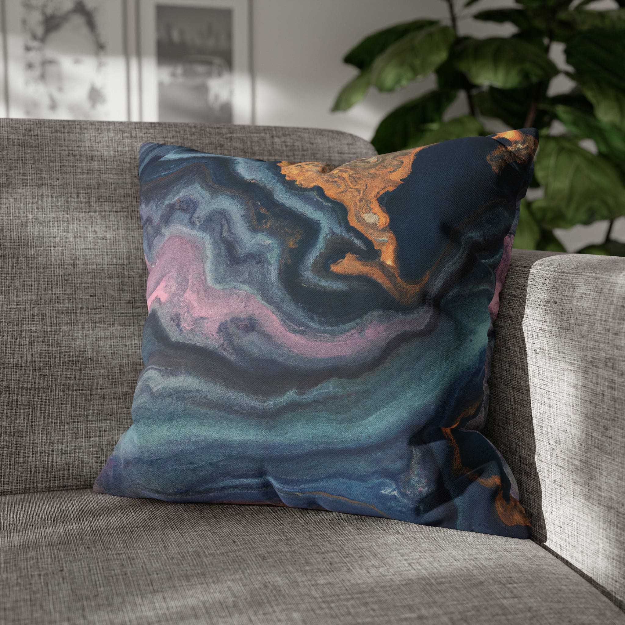 Decorative throw pillow cover featuring a blue, pink, and gold marble swirl pattern, showcasing vibrant colors and a luxurious design.