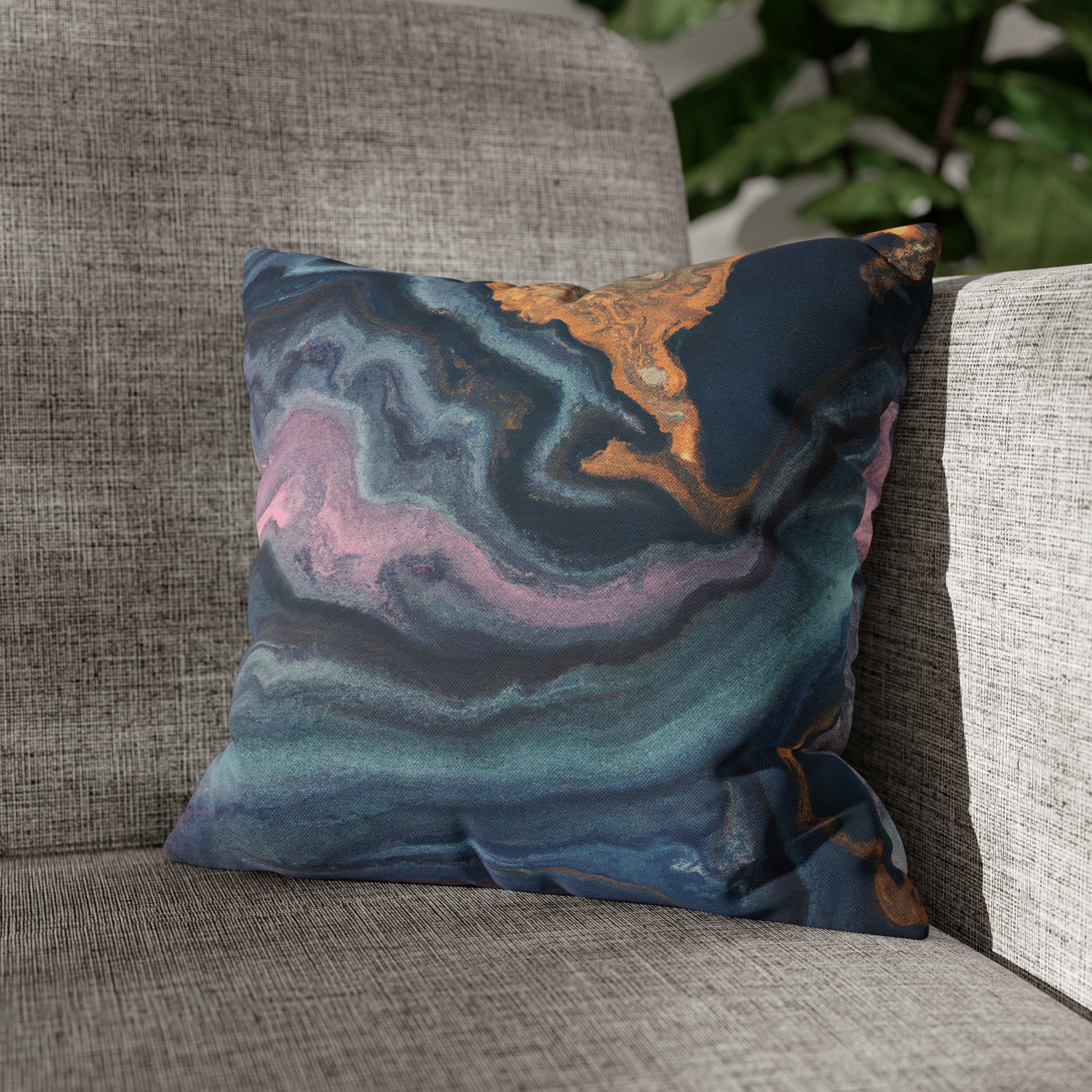 Decorative throw pillow cover featuring a blue, pink, and gold marble swirl pattern, showcasing vibrant colors and a luxurious design.