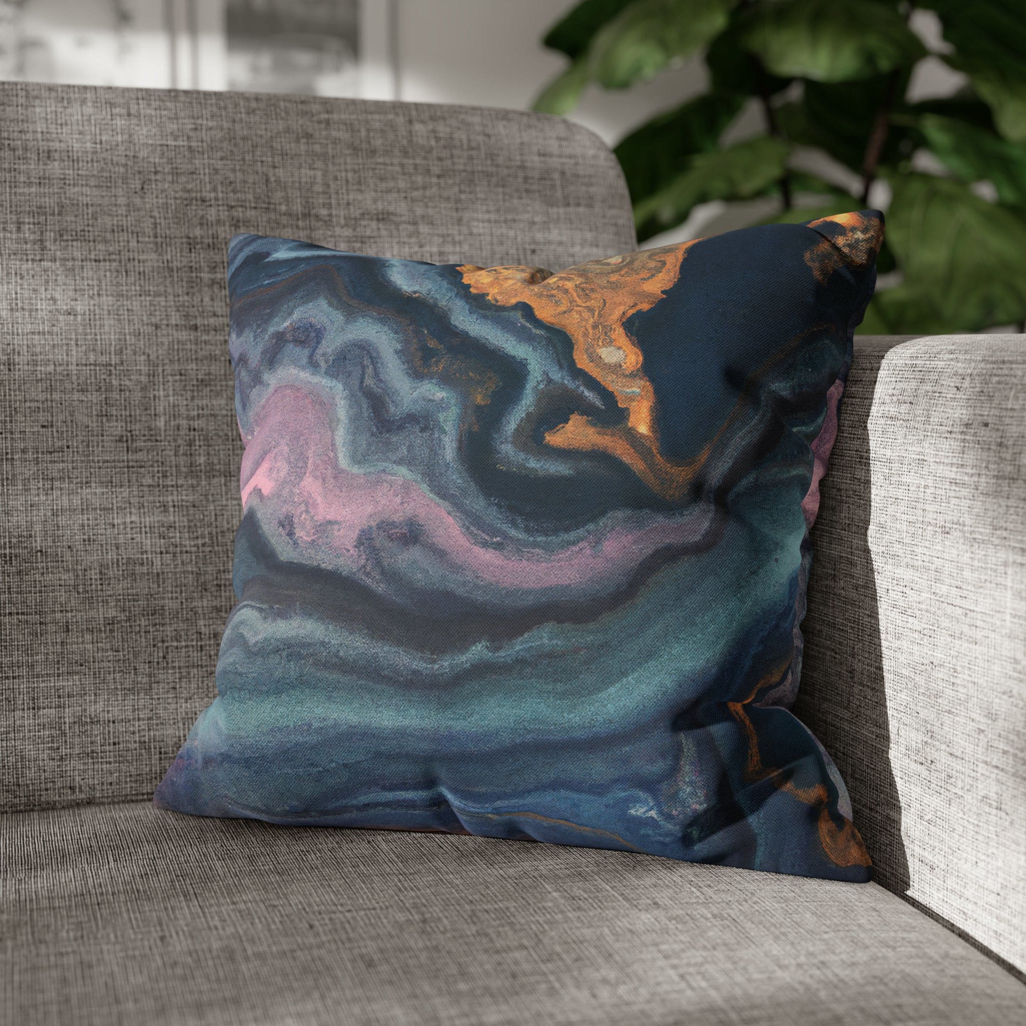 Decorative throw pillow cover featuring a blue, pink, and gold marble swirl pattern, showcasing vibrant colors and a luxurious design.