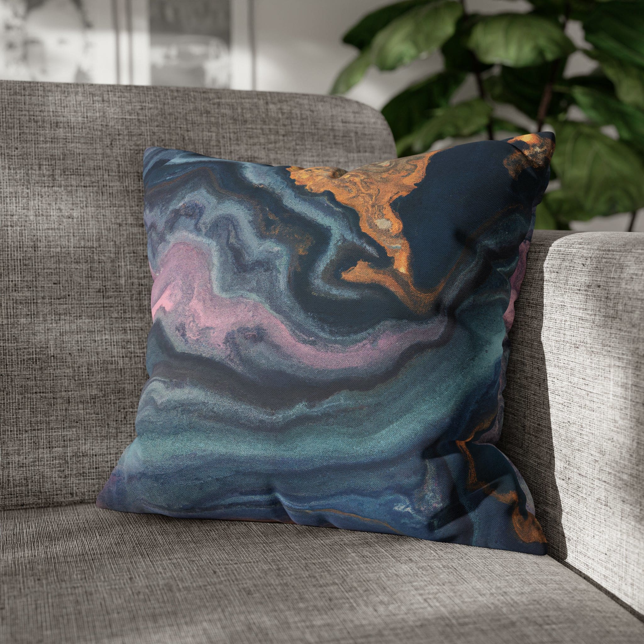 Decorative throw pillow cover featuring a blue, pink, and gold marble swirl pattern, showcasing vibrant colors and a luxurious design.