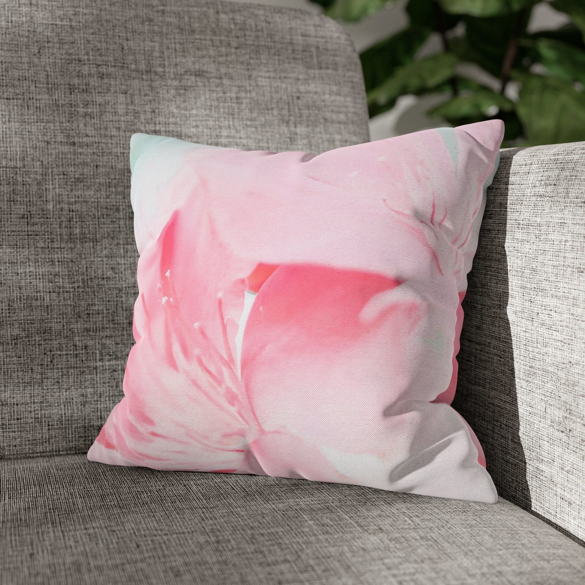 Decorative throw pillow cover featuring a peaceful pink flower bloom design, showcasing vibrant colors and a concealed zipper.