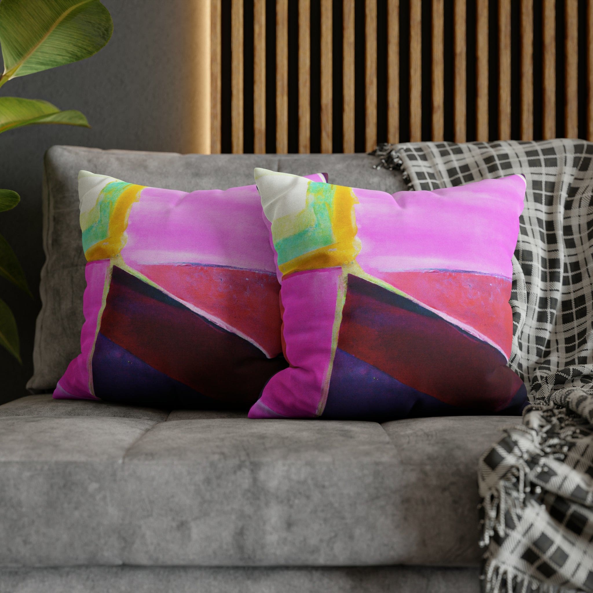 Decorative throw pillow cover featuring a pink, purple, and red geometric pattern, showcasing its vibrant colors and stylish design.