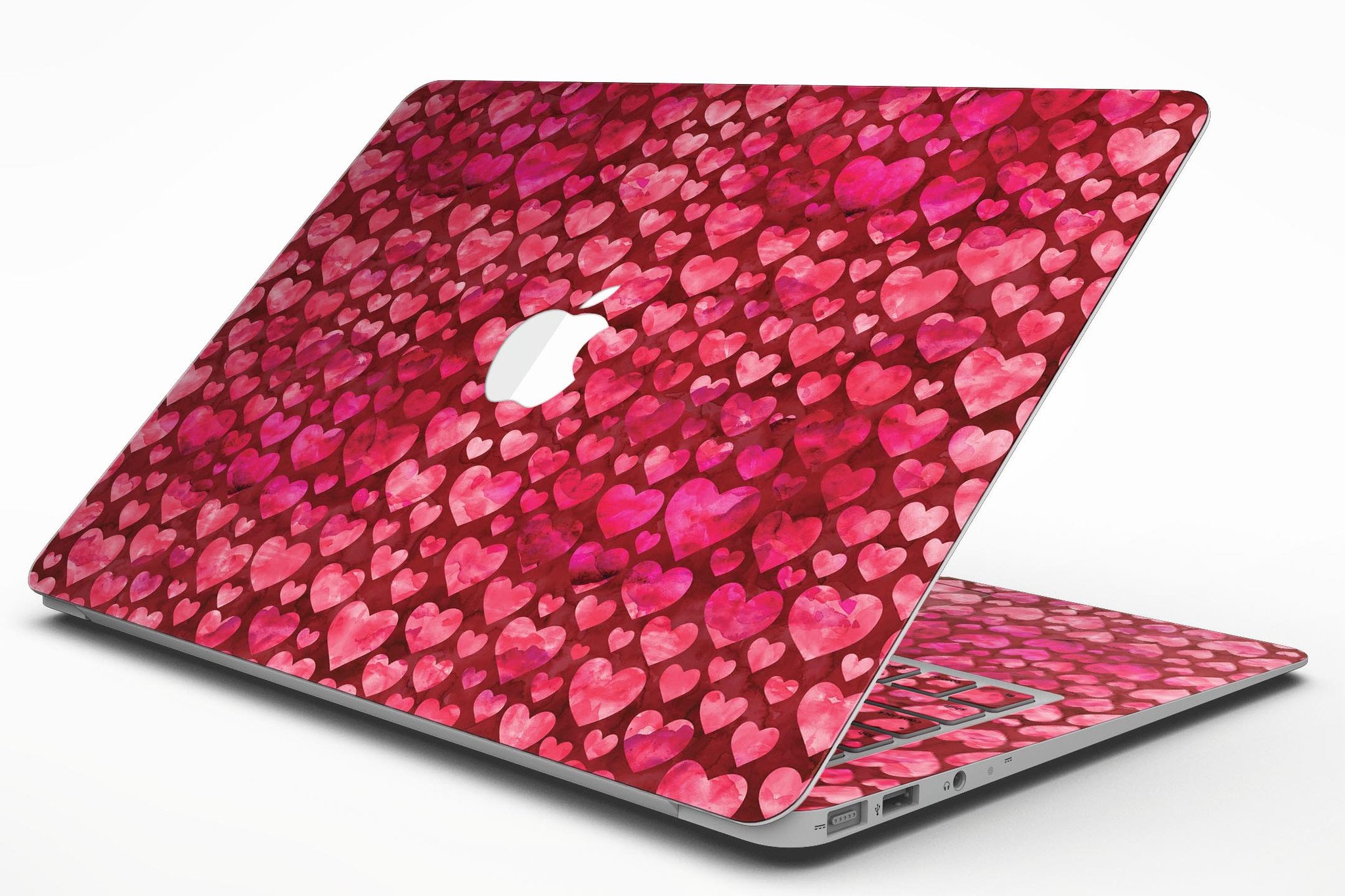 Deep Pink Watercolor Hearts MacBook Air Skin Kit showcasing vibrant heart patterns on a sleek laptop surface.