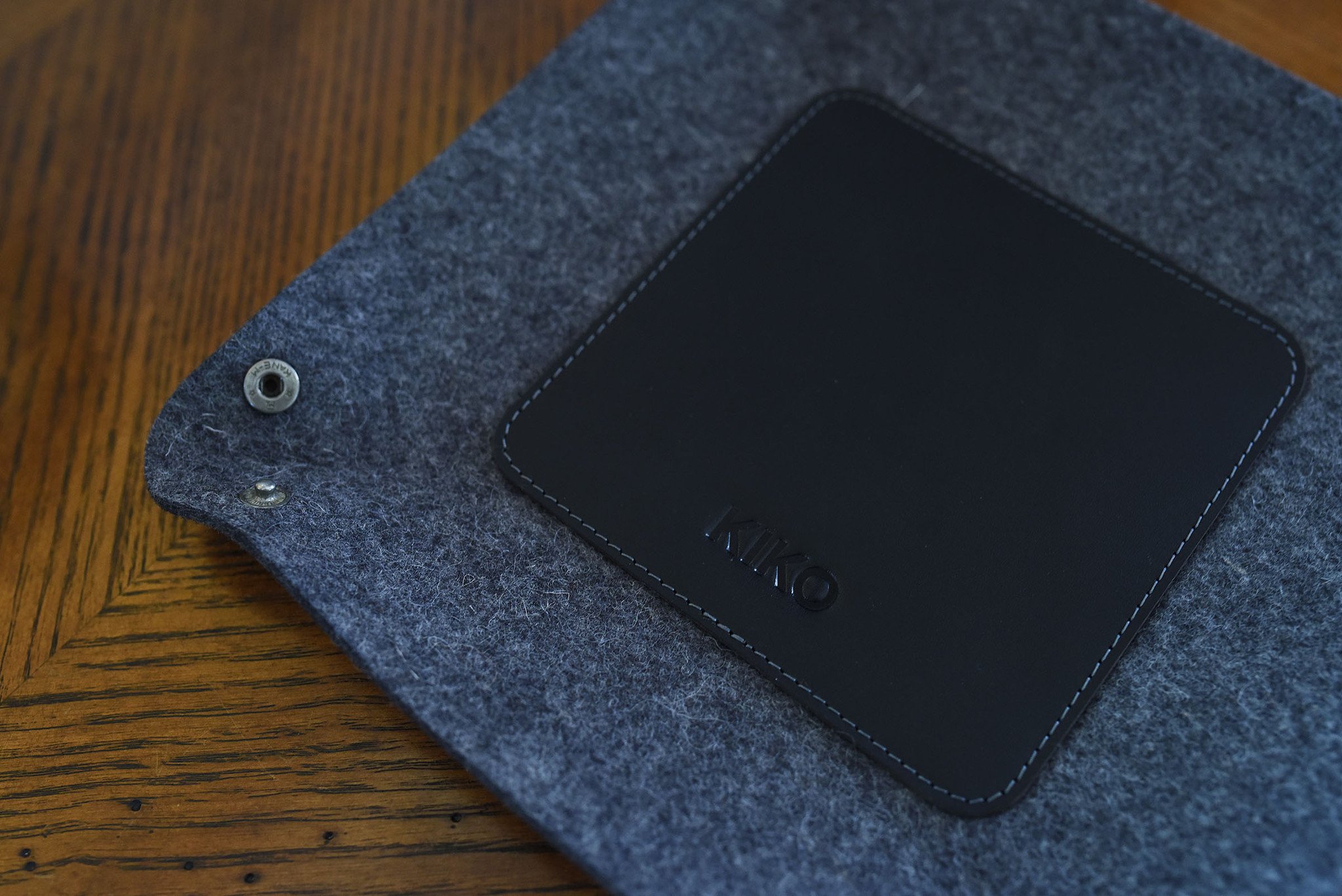 Chic Desk Tray made of soft grey wool felt and leather, designed to organize essentials like keys and phone.