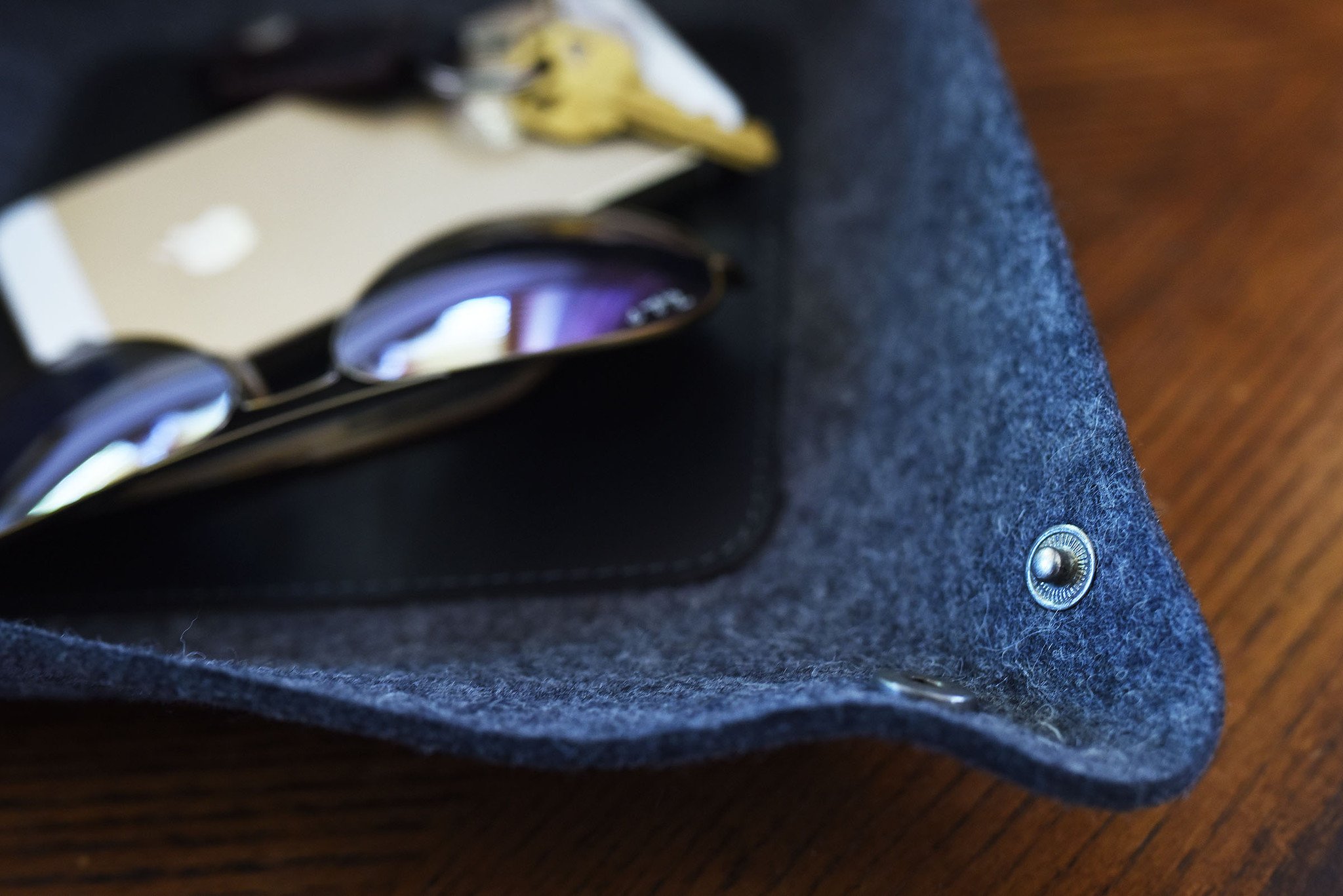 Chic Desk Tray made of soft grey wool felt and leather, designed to organize essentials like keys and phone.