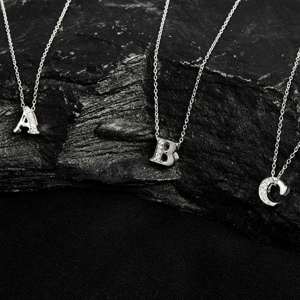 Elegant Diamond Initial Letter Pendant Necklace in Silver, featuring sparkling diamonds and a delicate design.