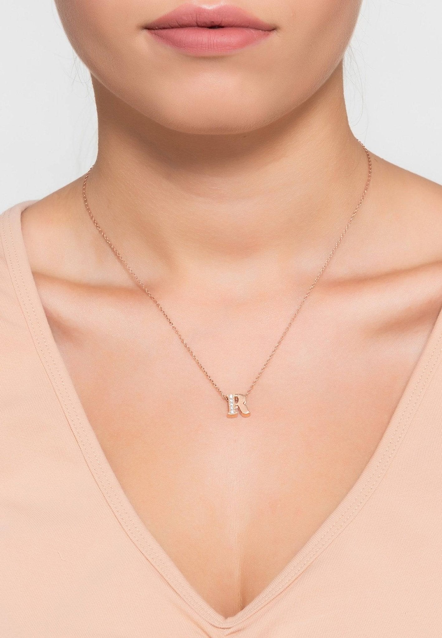 Elegant Diamond Initial Letter Pendant Necklace in Silver R, featuring a delicate design with sparkling diamonds set in sterling silver.