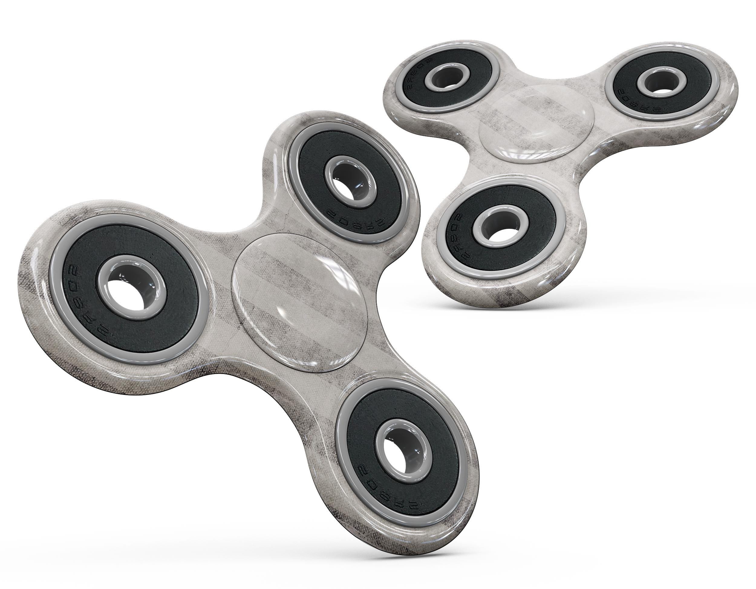 Disappearing Black and White Vertical Stripes Full-Body Fidget Spinner skin showcasing a stylish design with a premium vinyl finish.