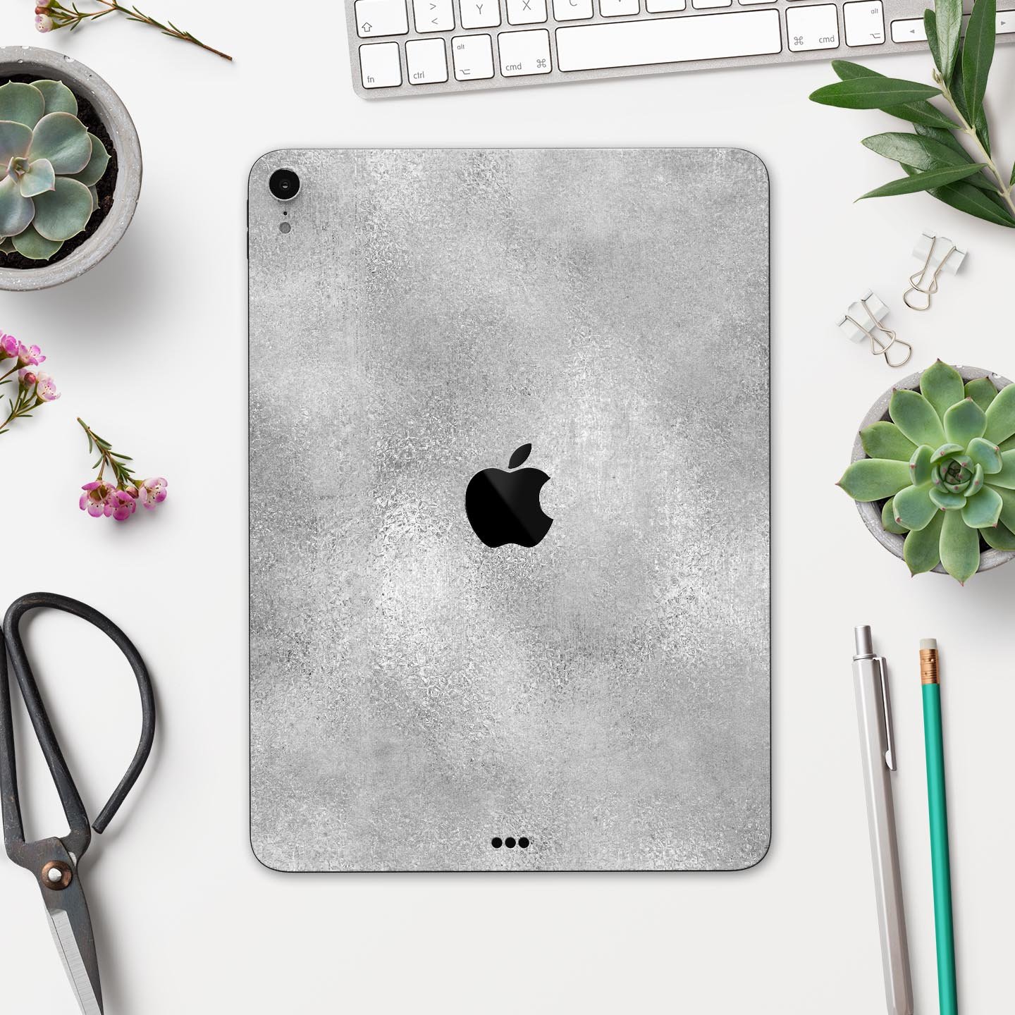 Distressed Silver Texture v11 skin decal for Apple device, showcasing a sleek design and premium finish.