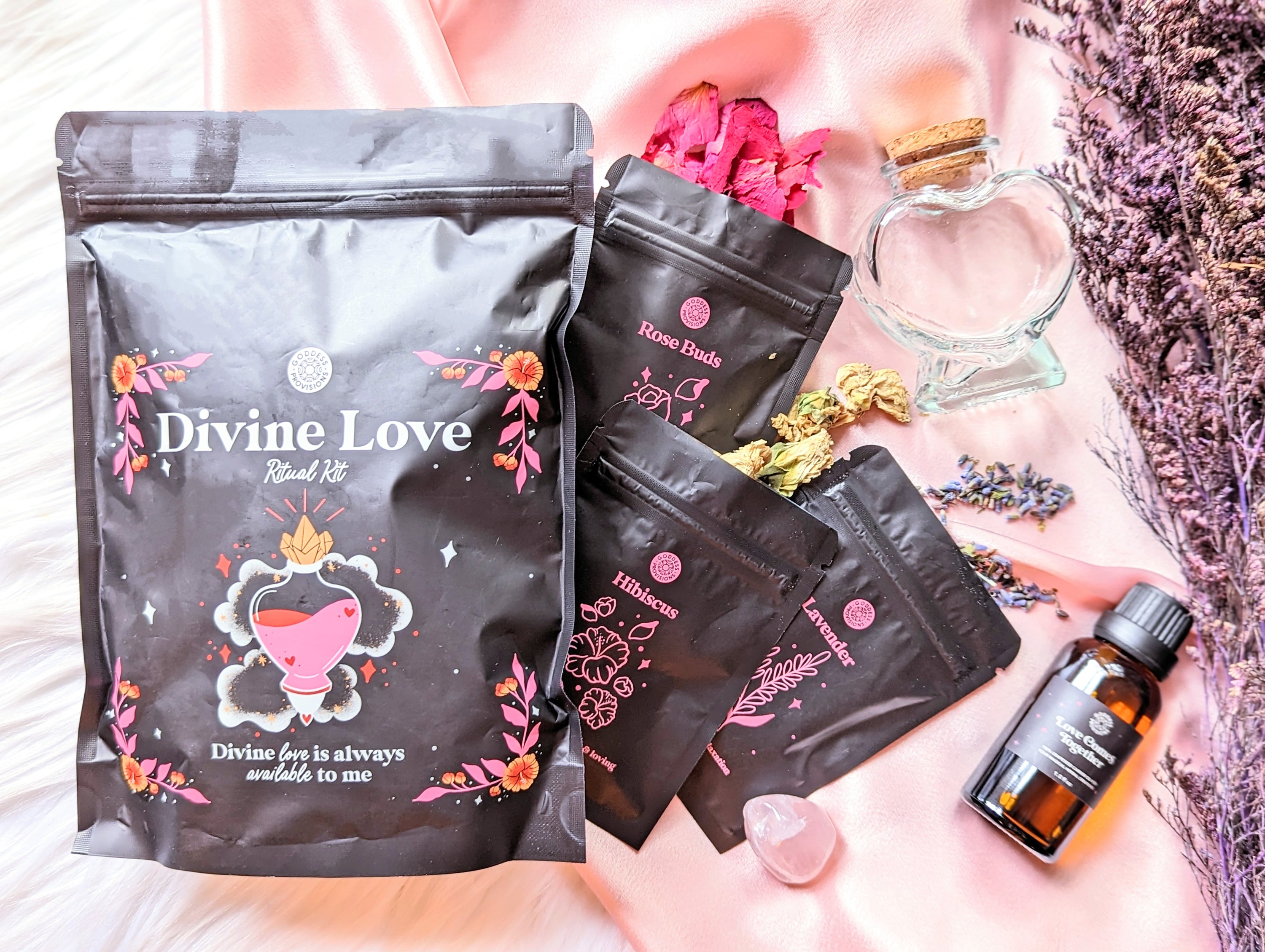 Divine Love Ritual Kit by Goddess Provisions featuring dried flowers, rose quartz, and a heart-shaped jar.